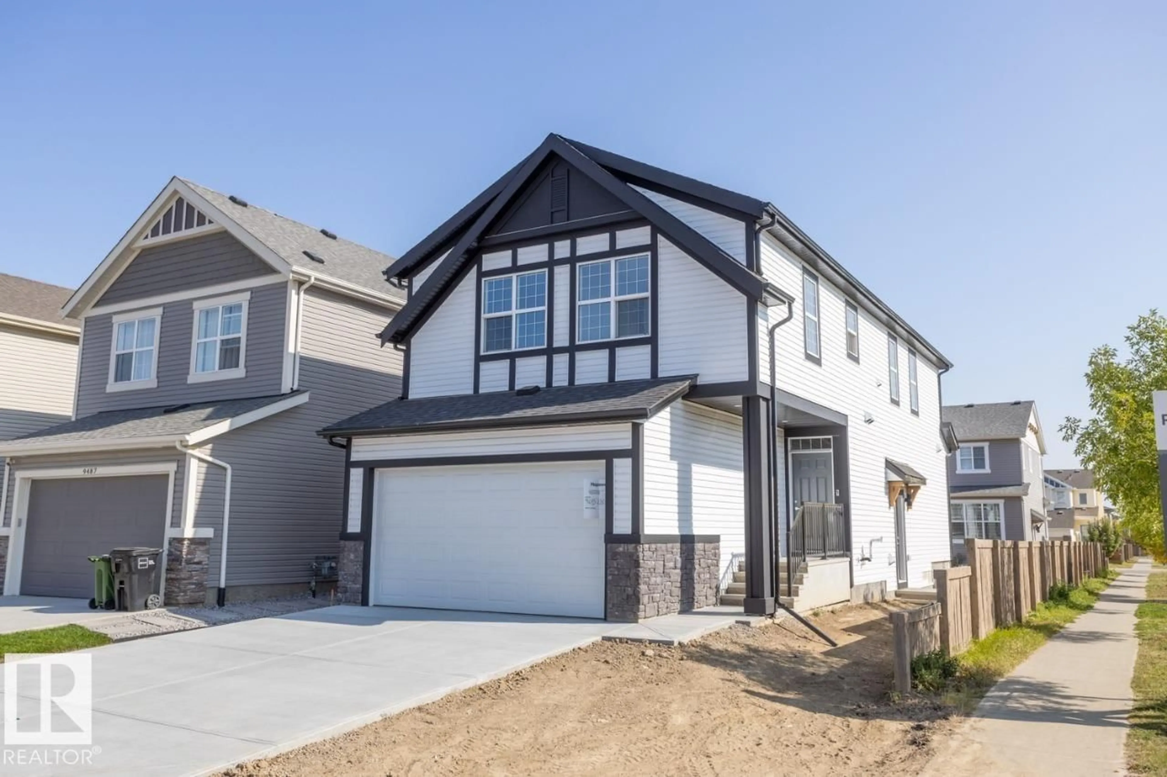 Home with vinyl exterior material, street for NW - 9483 228 ST, Edmonton Alberta T5T7H5