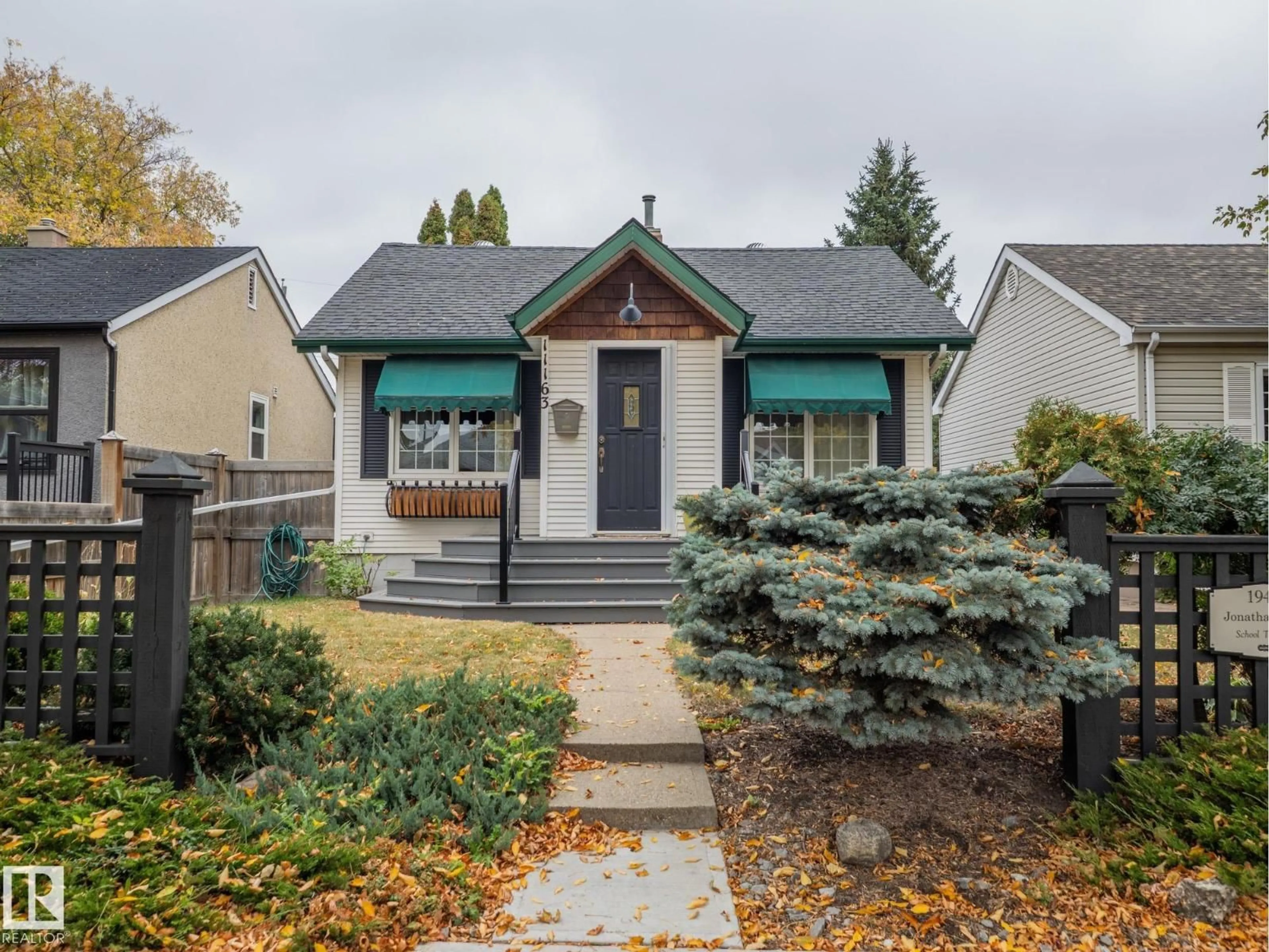 Home with vinyl exterior material, street for 11163 69 ST, Edmonton Alberta T5B1R3