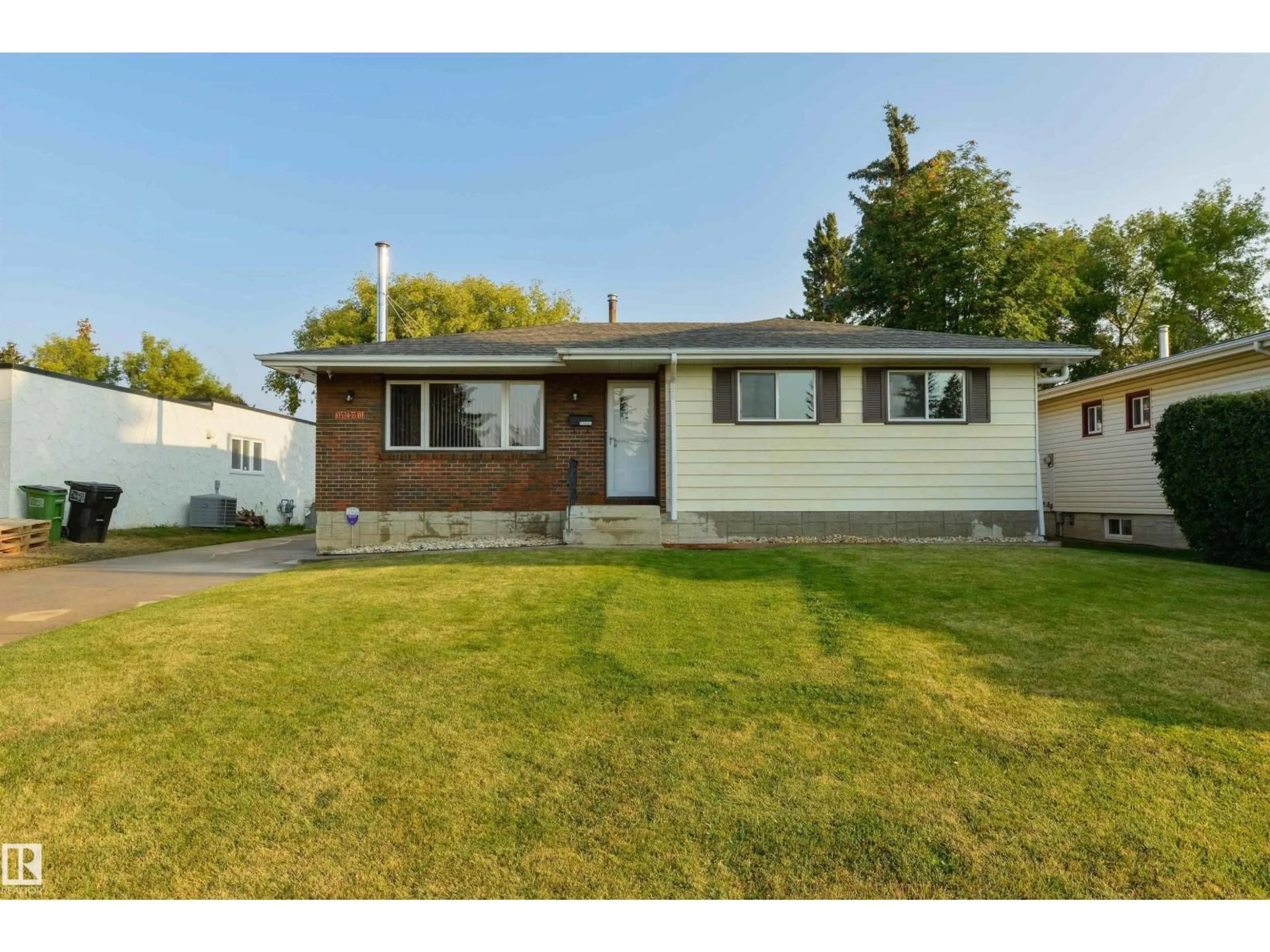 Home with vinyl exterior material, street for NW - 10524 35 AV, Edmonton Alberta T6H4Z5