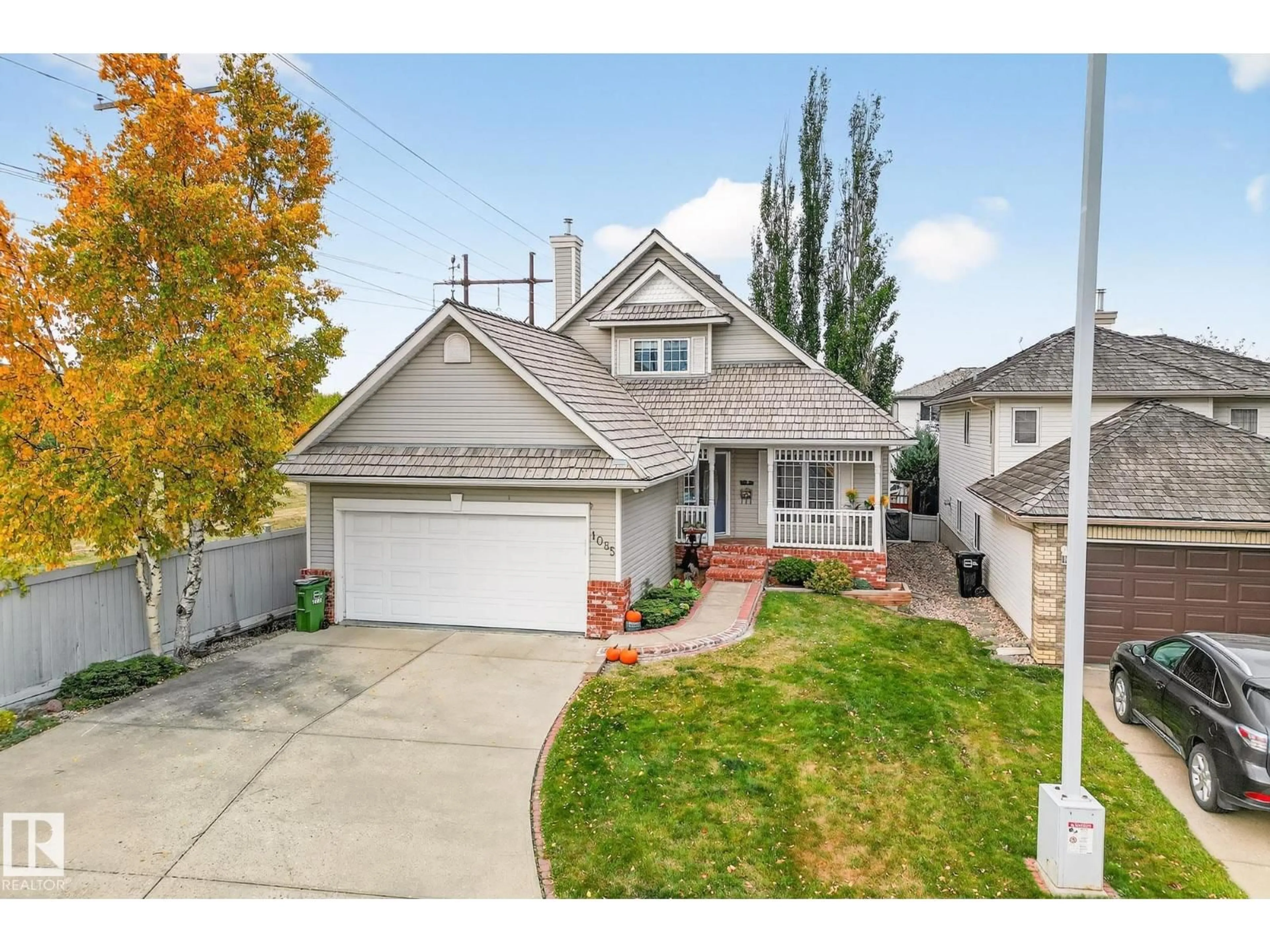 Home with vinyl exterior material, street for 1085 CARTER CREST RD, Edmonton Alberta T6R2N2