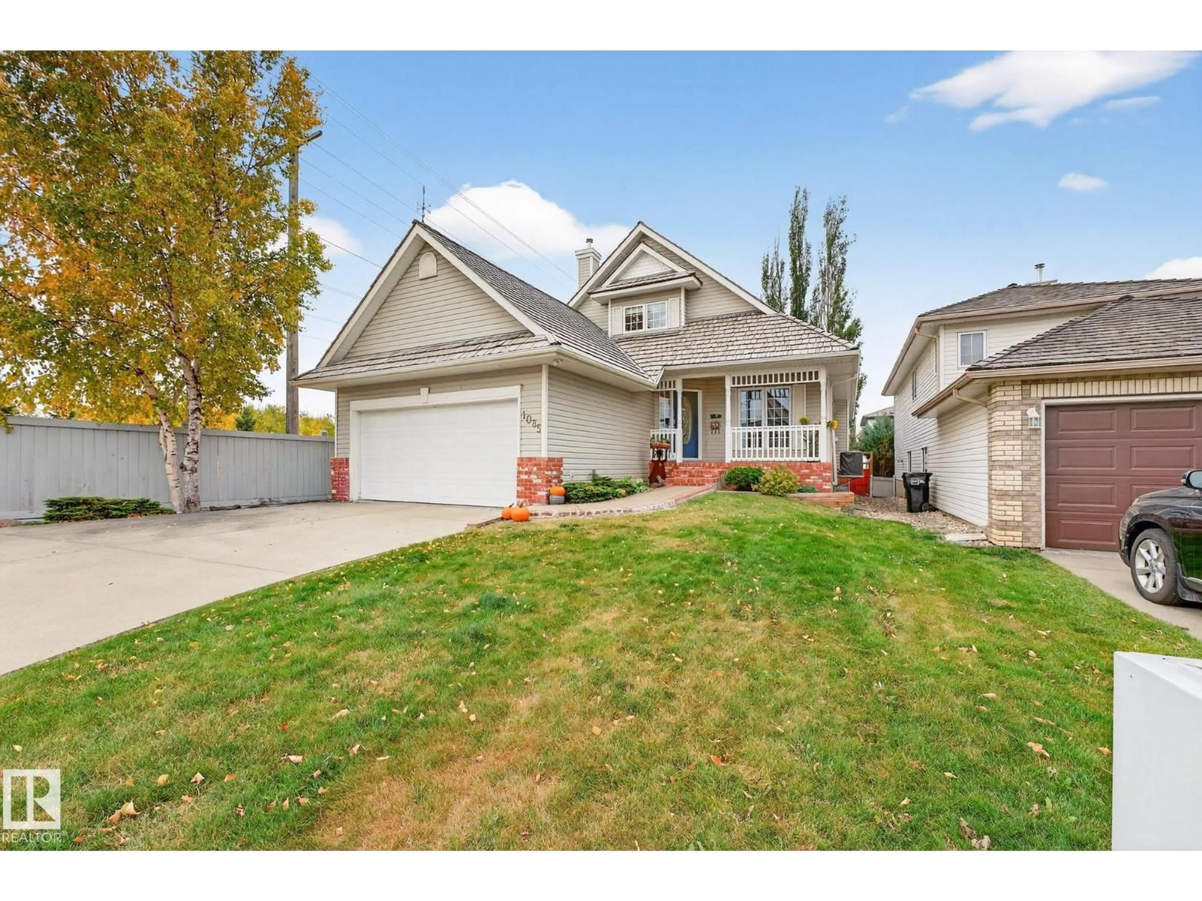 Home with vinyl exterior material, street for 1085 CARTER CREST RD, Edmonton Alberta T6R2N2