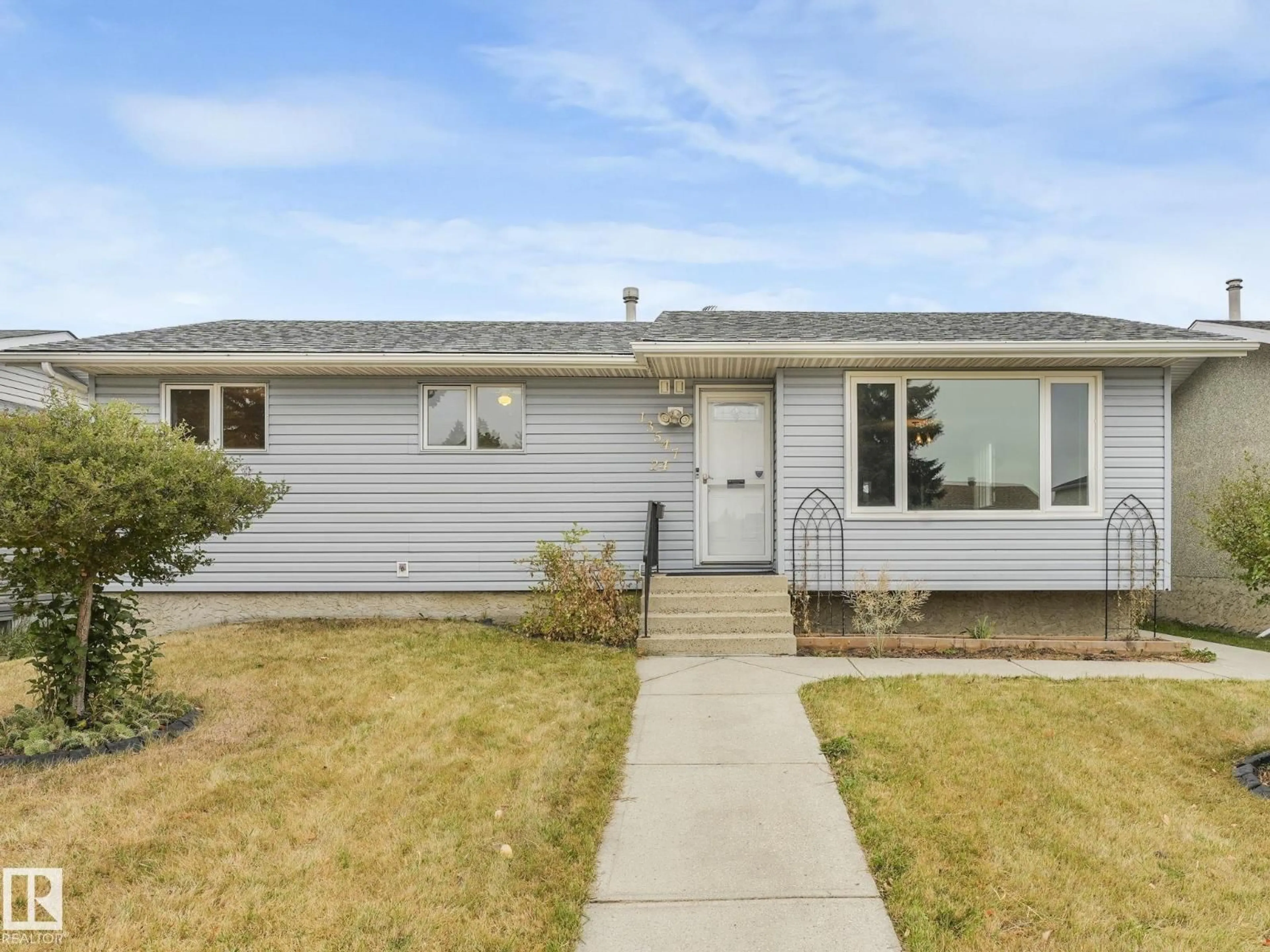 Home with vinyl exterior material, street for 13547 24 ST, Edmonton Alberta T5A3S7