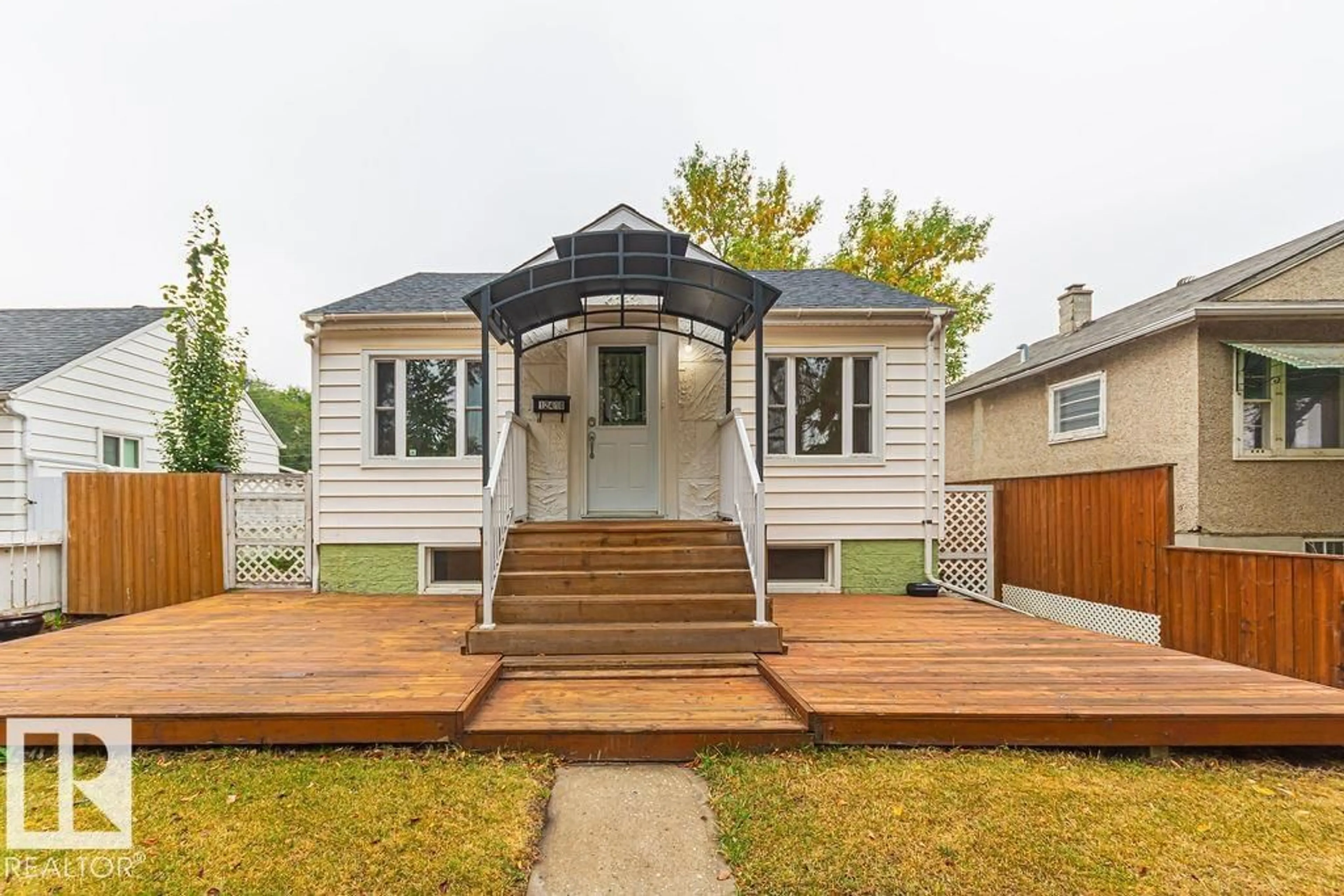 Home with vinyl exterior material, street for 12410 90 ST, Edmonton Alberta T5B3Z8