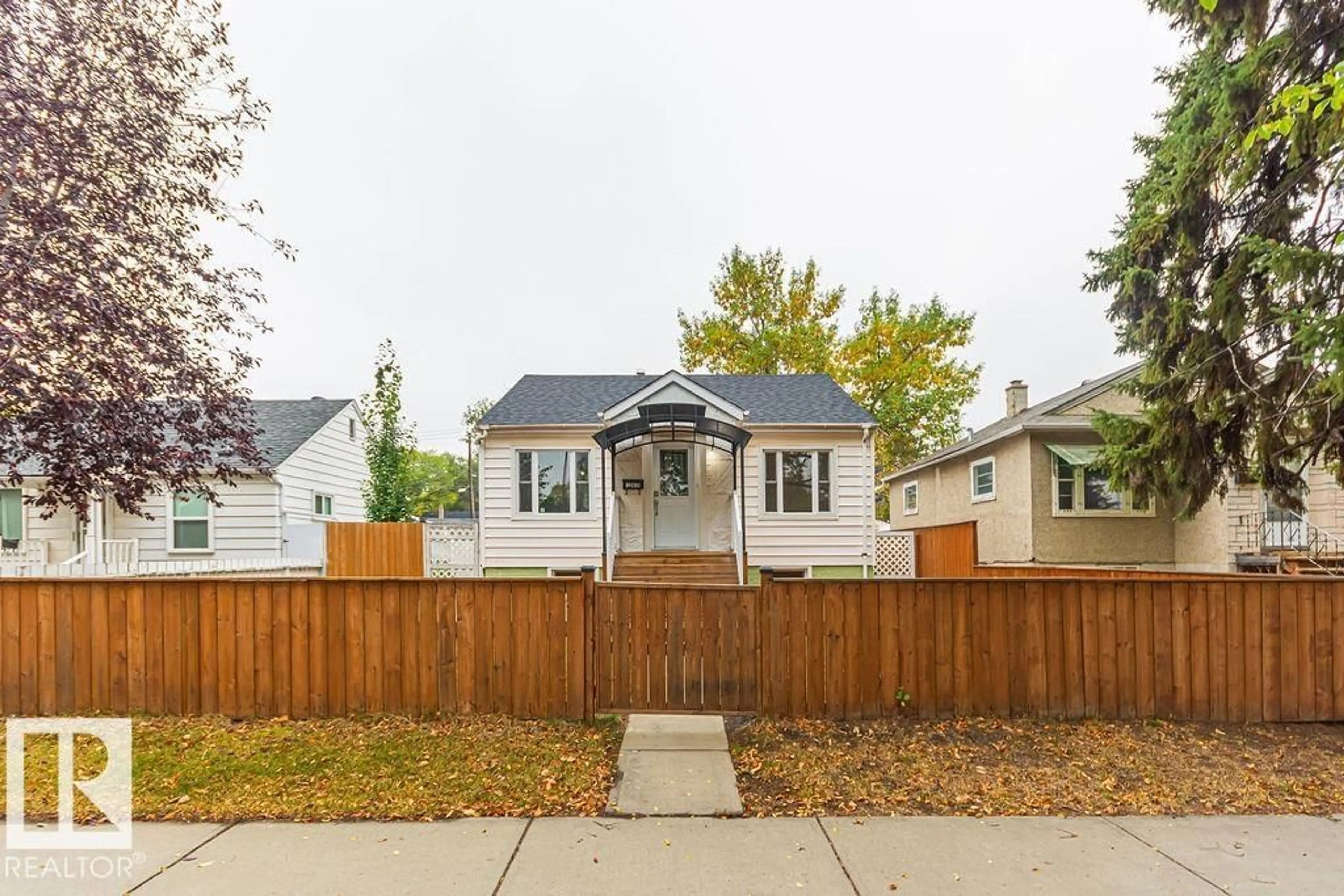 Home with vinyl exterior material, street for 12410 90 ST, Edmonton Alberta T5B3Z8