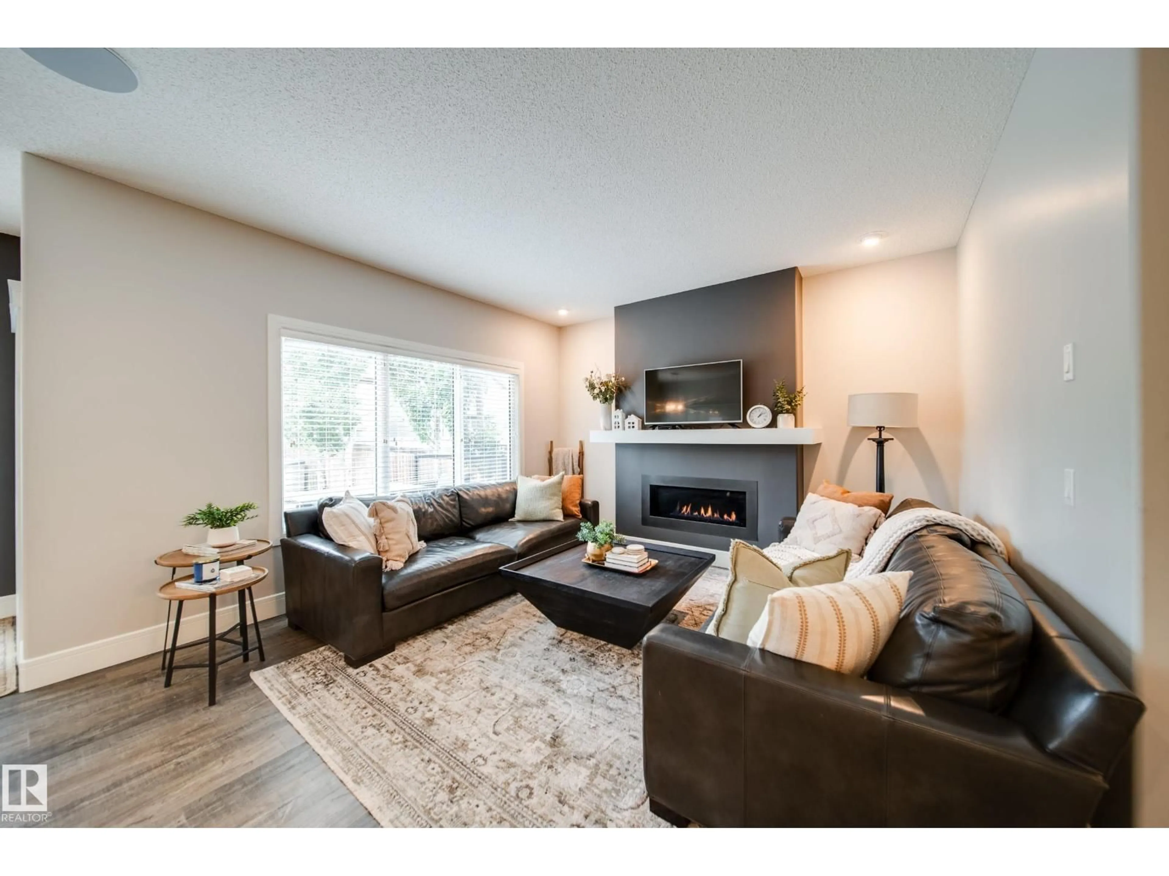 Living room with furniture, wood/laminate floor for 4373 CRABAPPLE CR, Edmonton Alberta T6X0X9