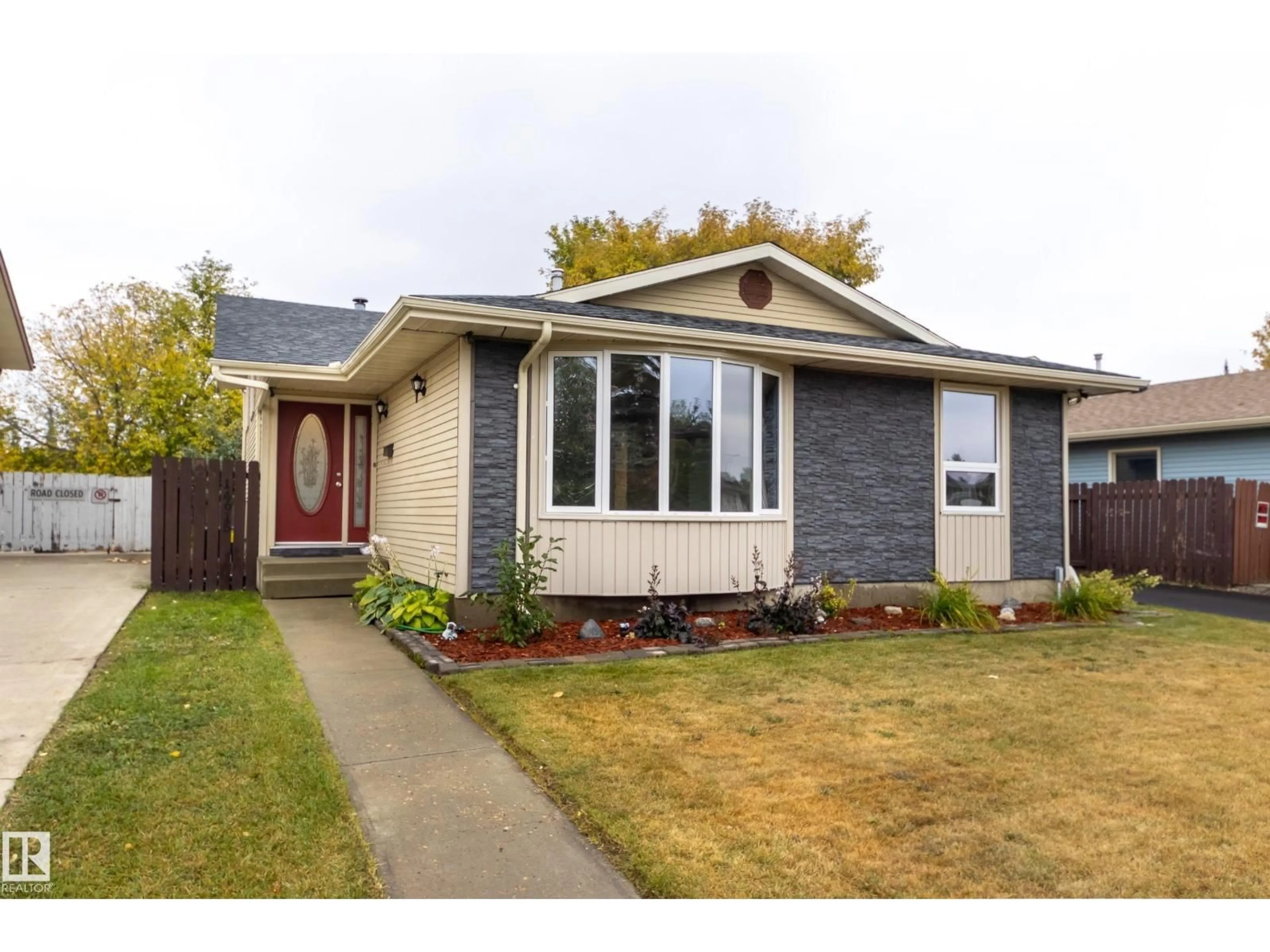 Home with vinyl exterior material, street for 14615 29A ST NW, Edmonton Alberta T5Y2E4