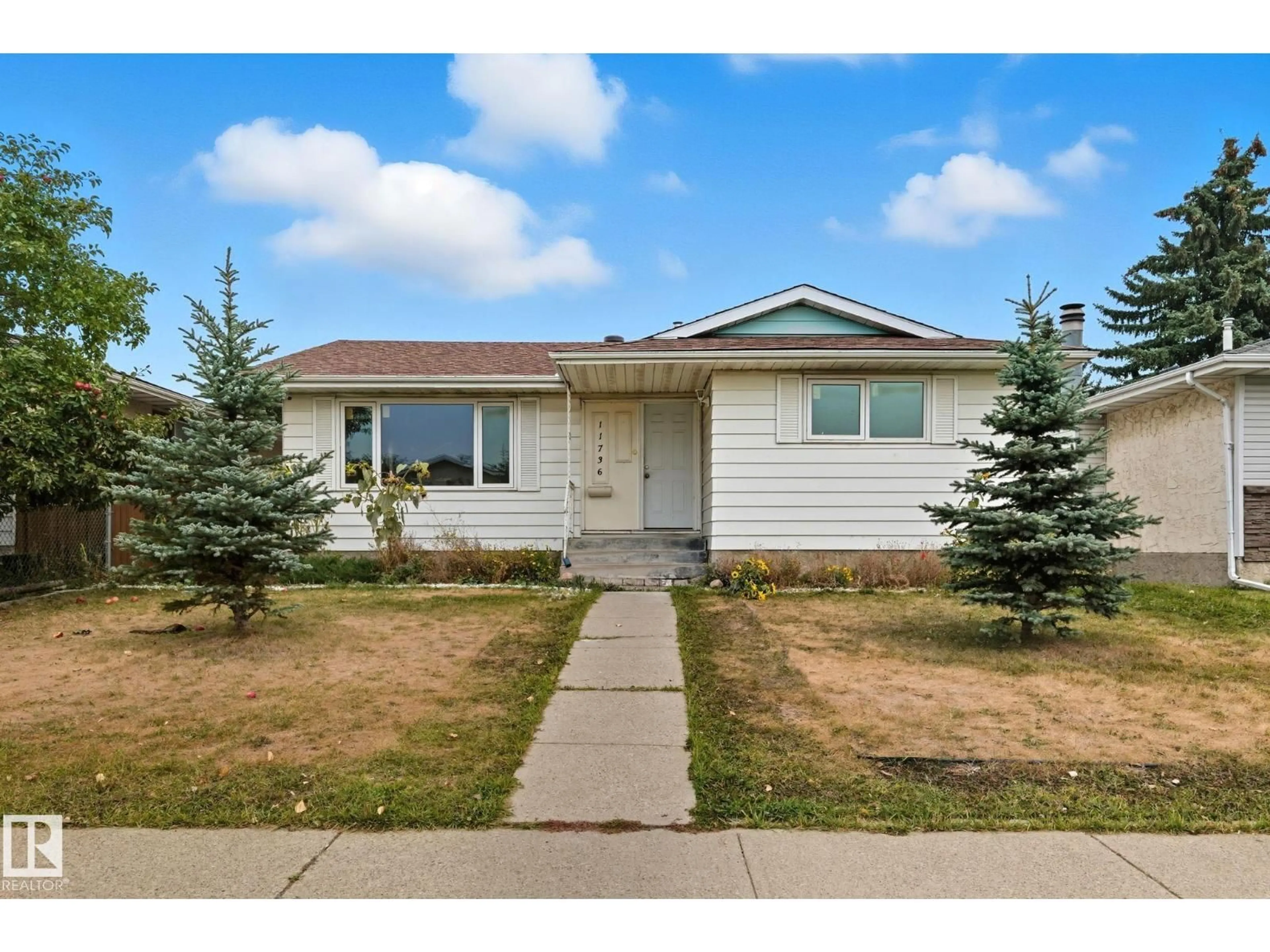 Home with vinyl exterior material, street for NW - 11736 152 AV, Edmonton Alberta T5X1S8