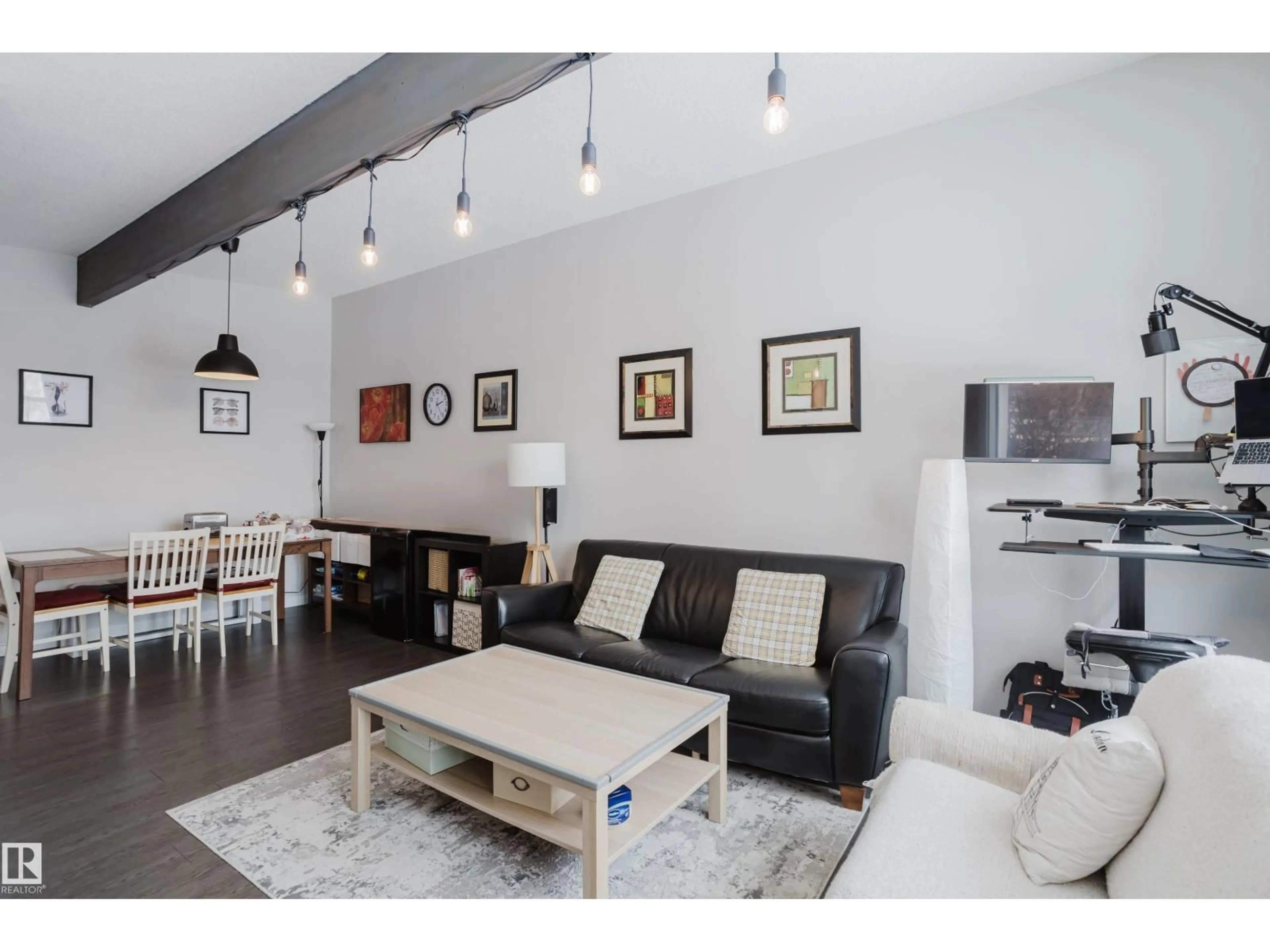 Living room with furniture, wood/laminate floor for NW - 8123 8125 83 AV, Edmonton Alberta T6C1A7