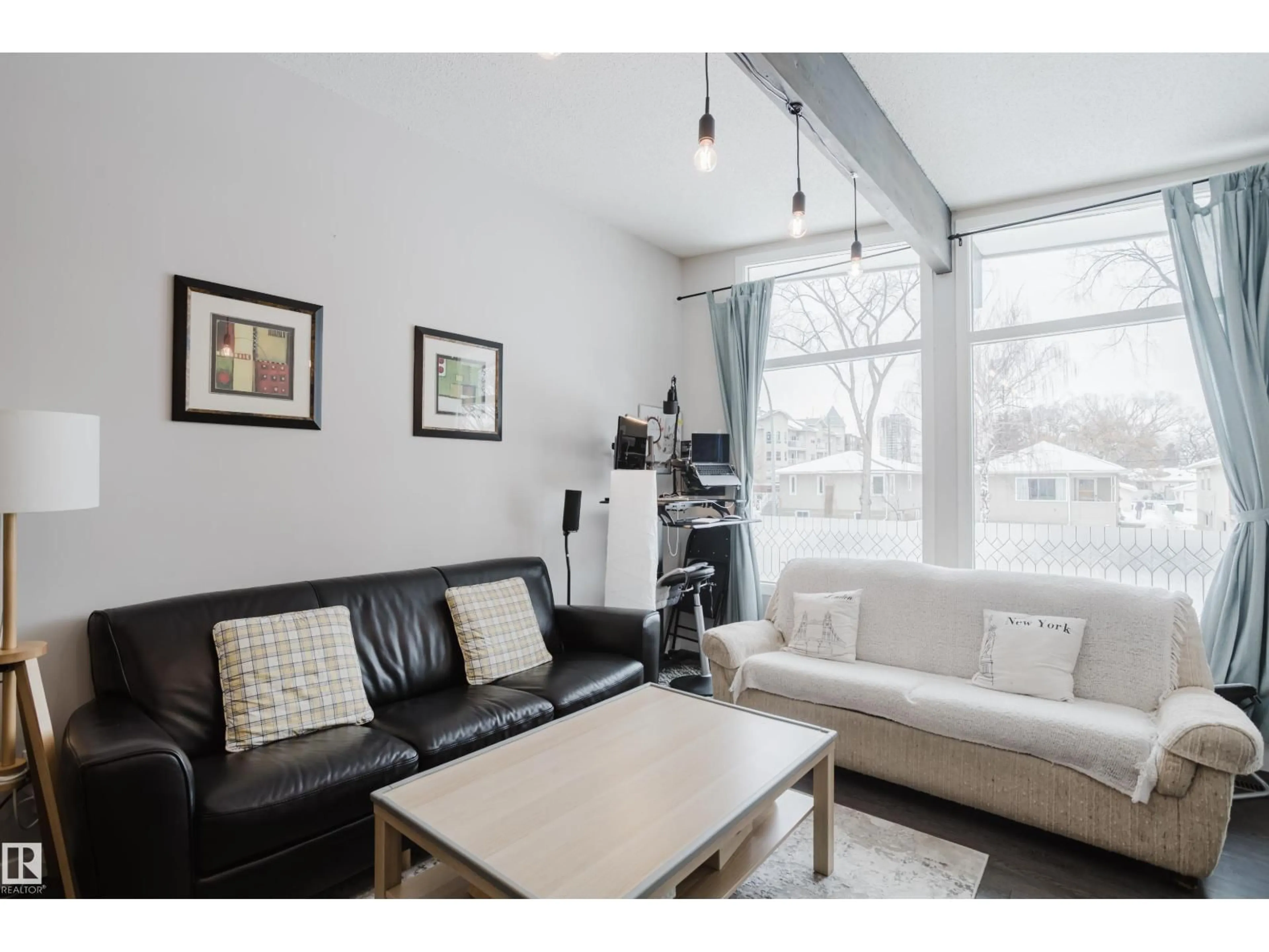 Living room with furniture, wood/laminate floor for NW - 8123 8125 83 AV, Edmonton Alberta T6C1A7