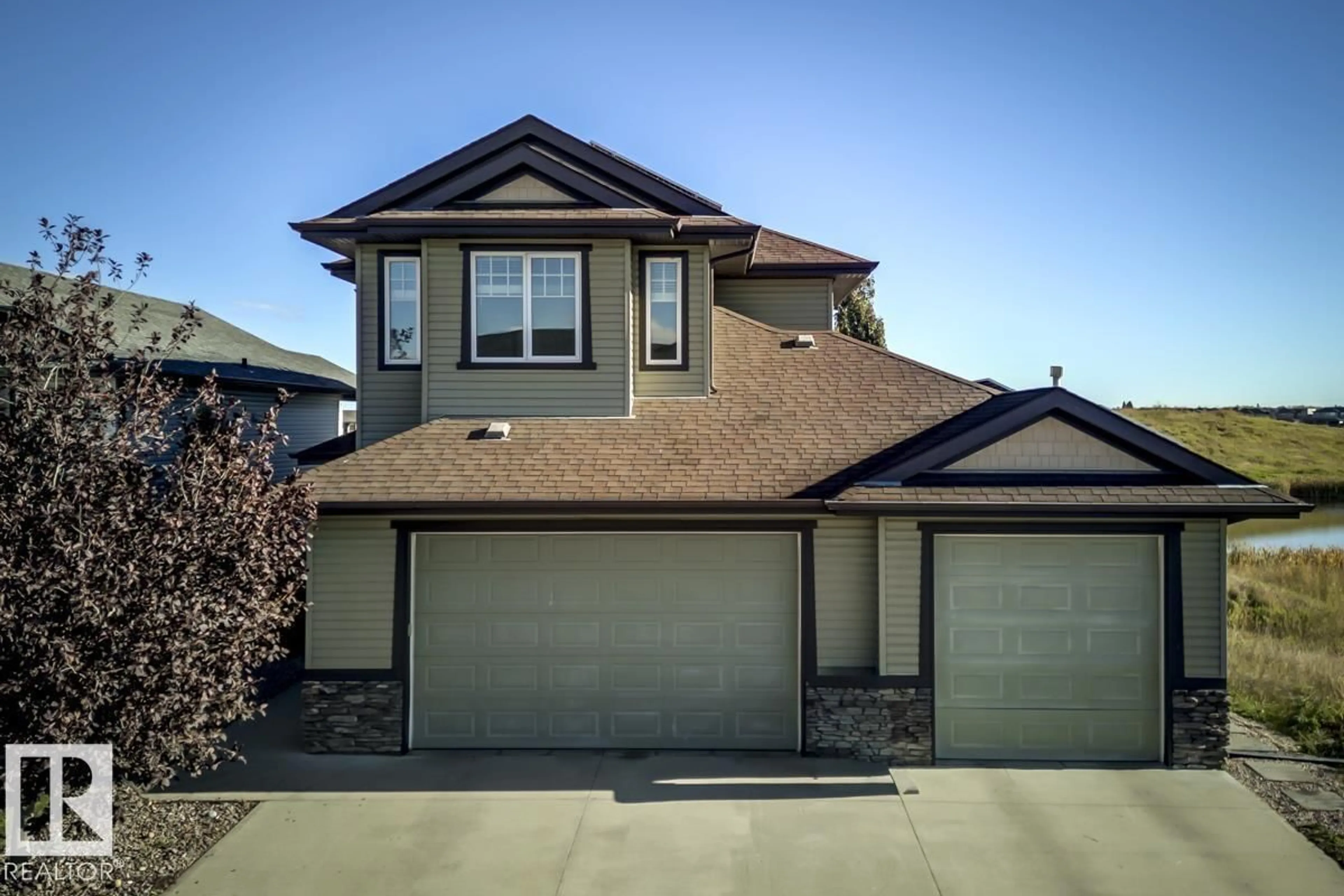 Home with vinyl exterior material, street for 63 LAKEWOOD BV, Beaumont Alberta T4X0B5