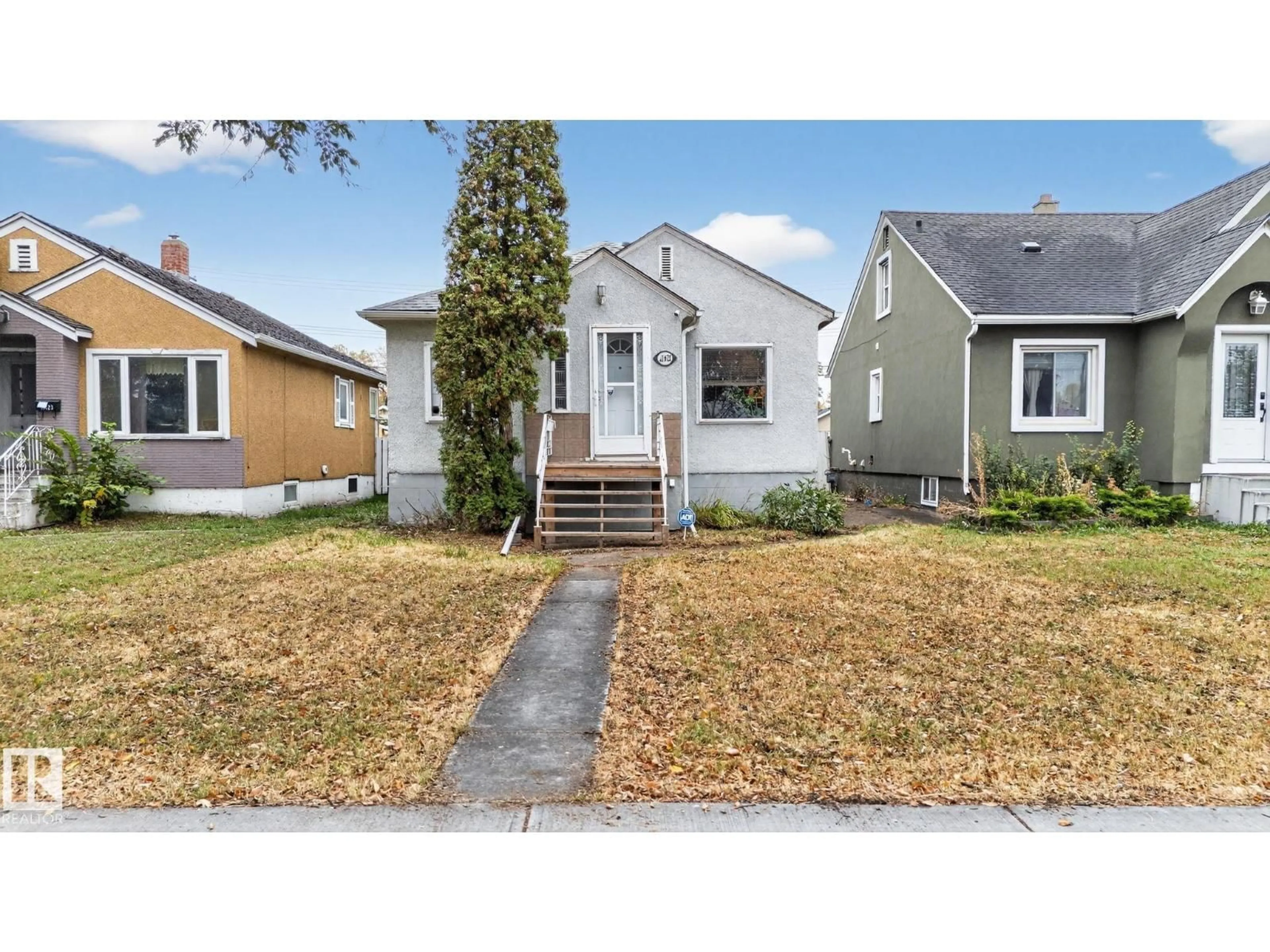 Home with vinyl exterior material, street for 11621 101 ST, Edmonton Alberta T5G2B3