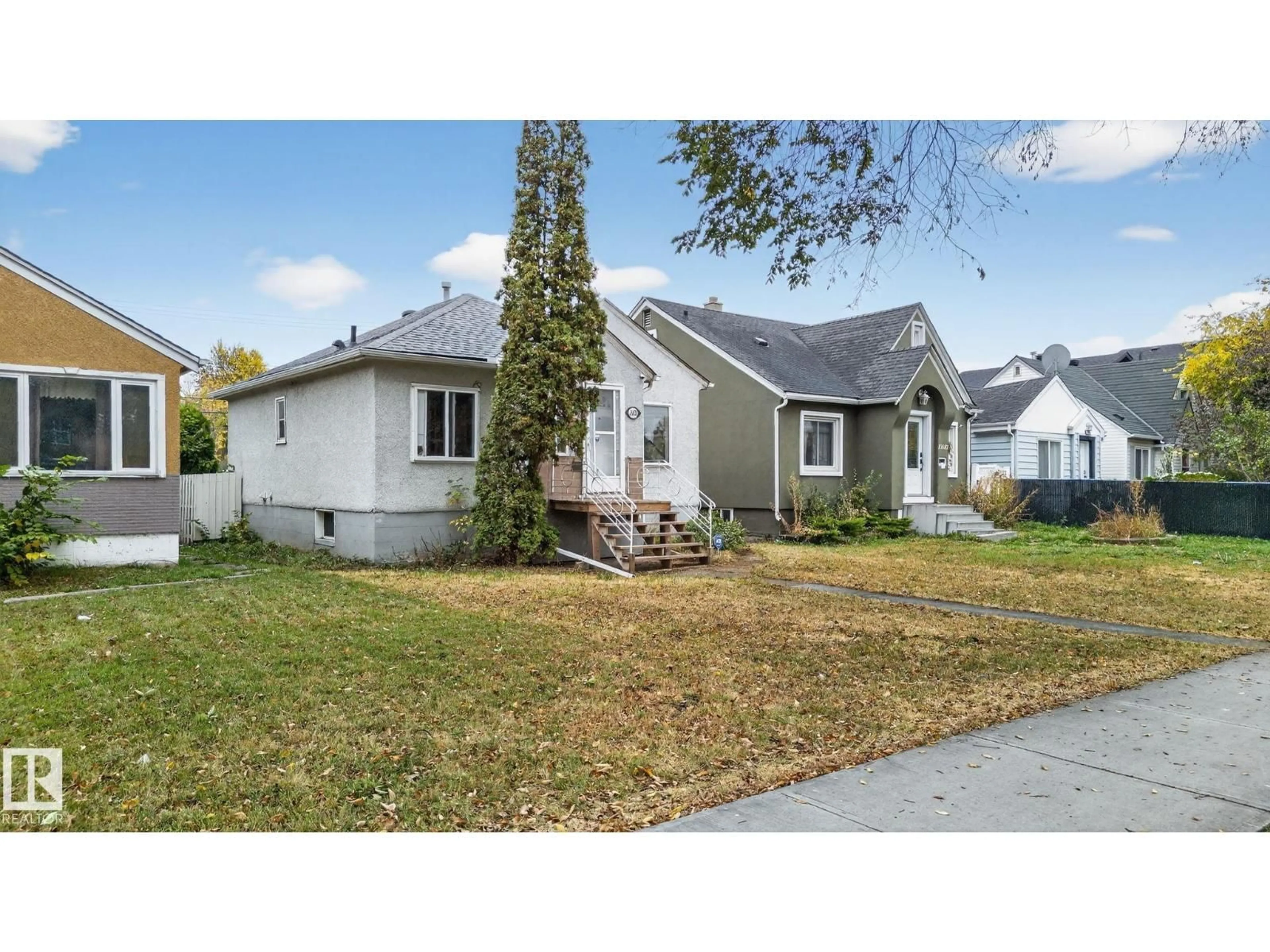 Home with vinyl exterior material, street for 11621 101 ST, Edmonton Alberta T5G2B3