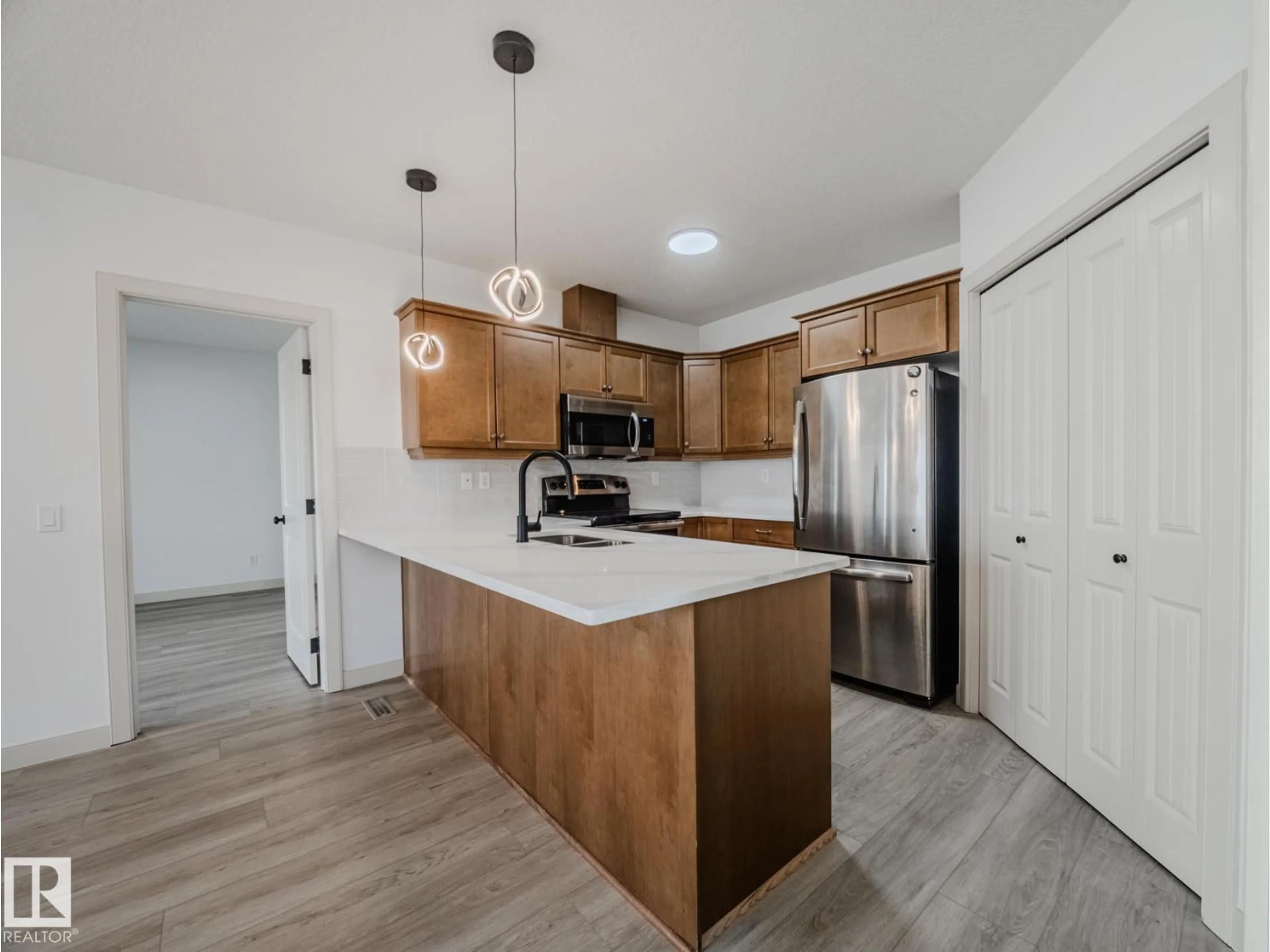 Open concept kitchen, unknown for #33 - 2565 HANNA CR, Edmonton Alberta T6R0M4