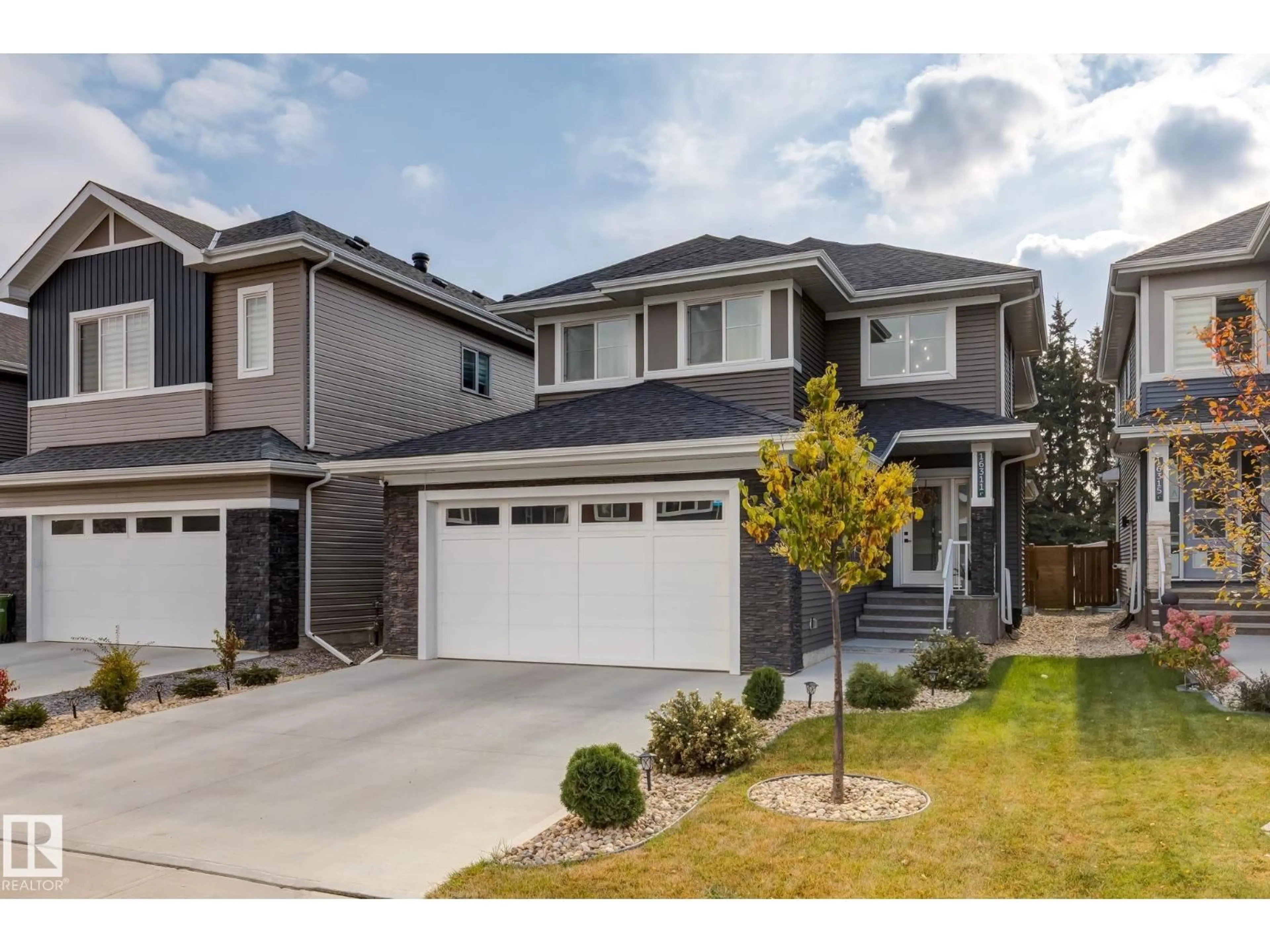 Home with vinyl exterior material, street for SW - 16311 34 AV, Edmonton Alberta T6W4V7