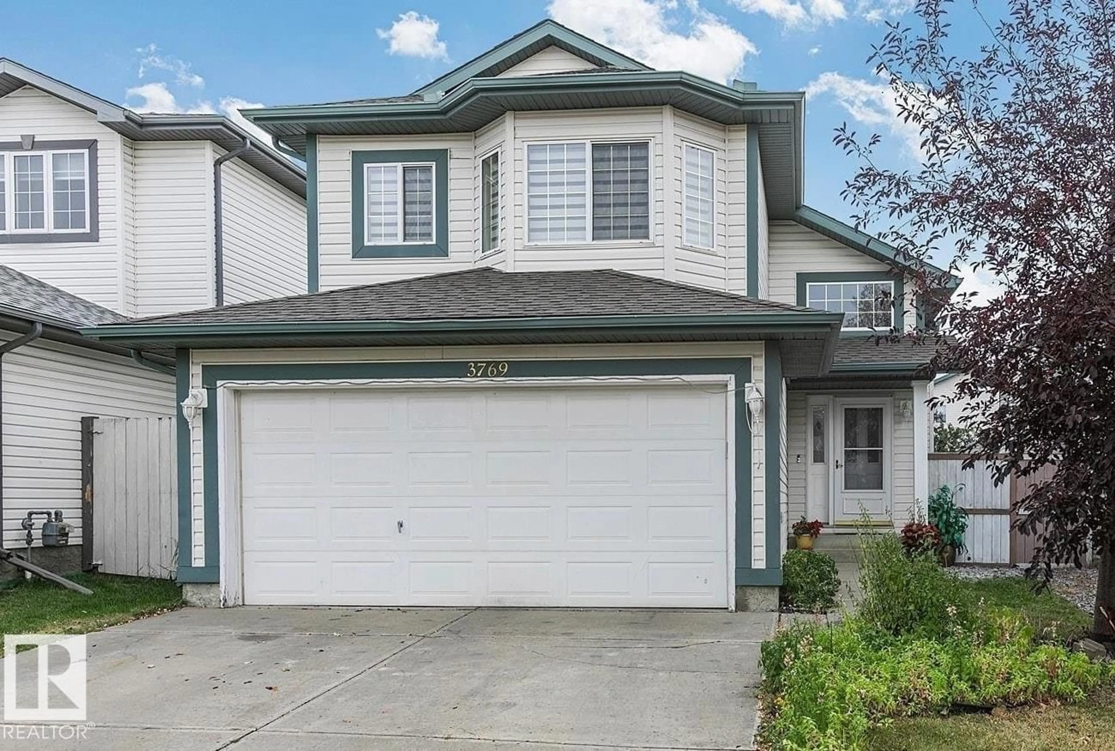 Home with vinyl exterior material, street for 3769 23 ST, Edmonton Alberta T6T1N8