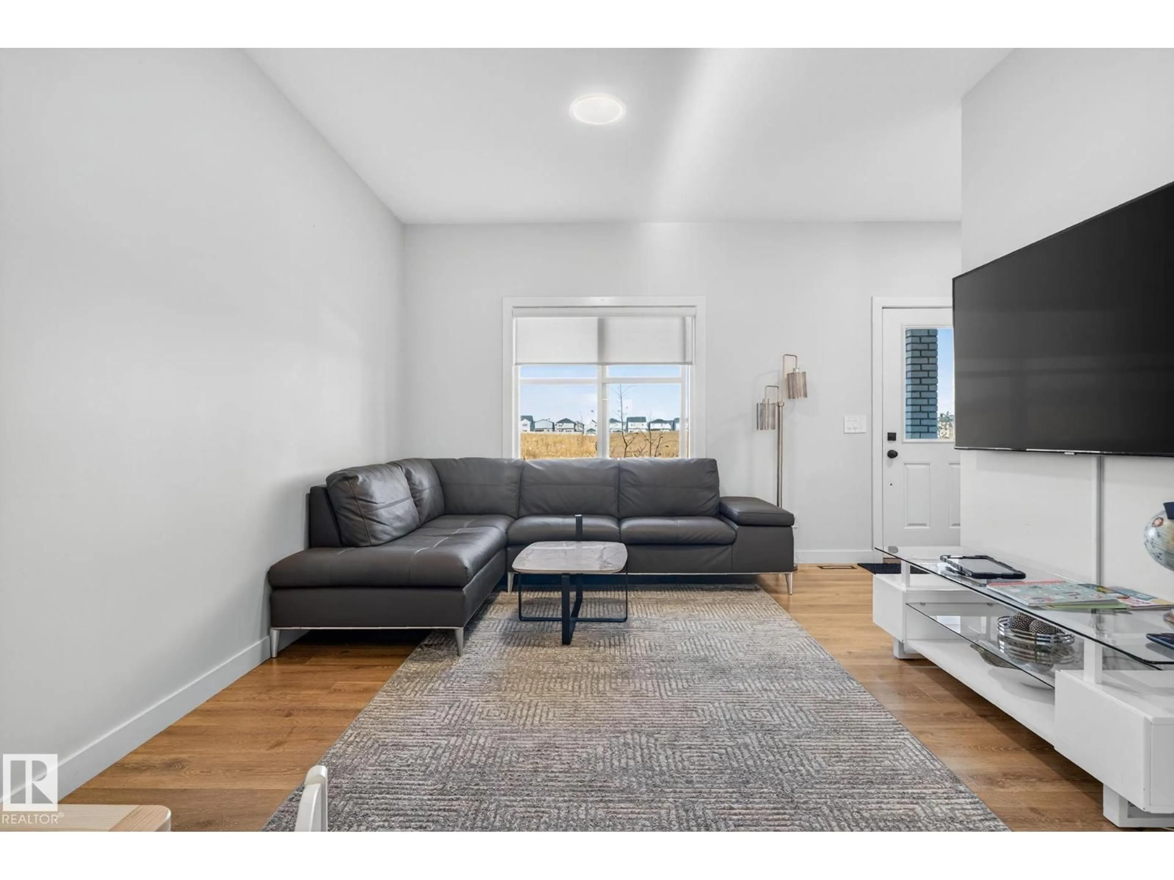 Living room with furniture, unknown for 7135 178 AV, Edmonton Alberta T5Z0T8