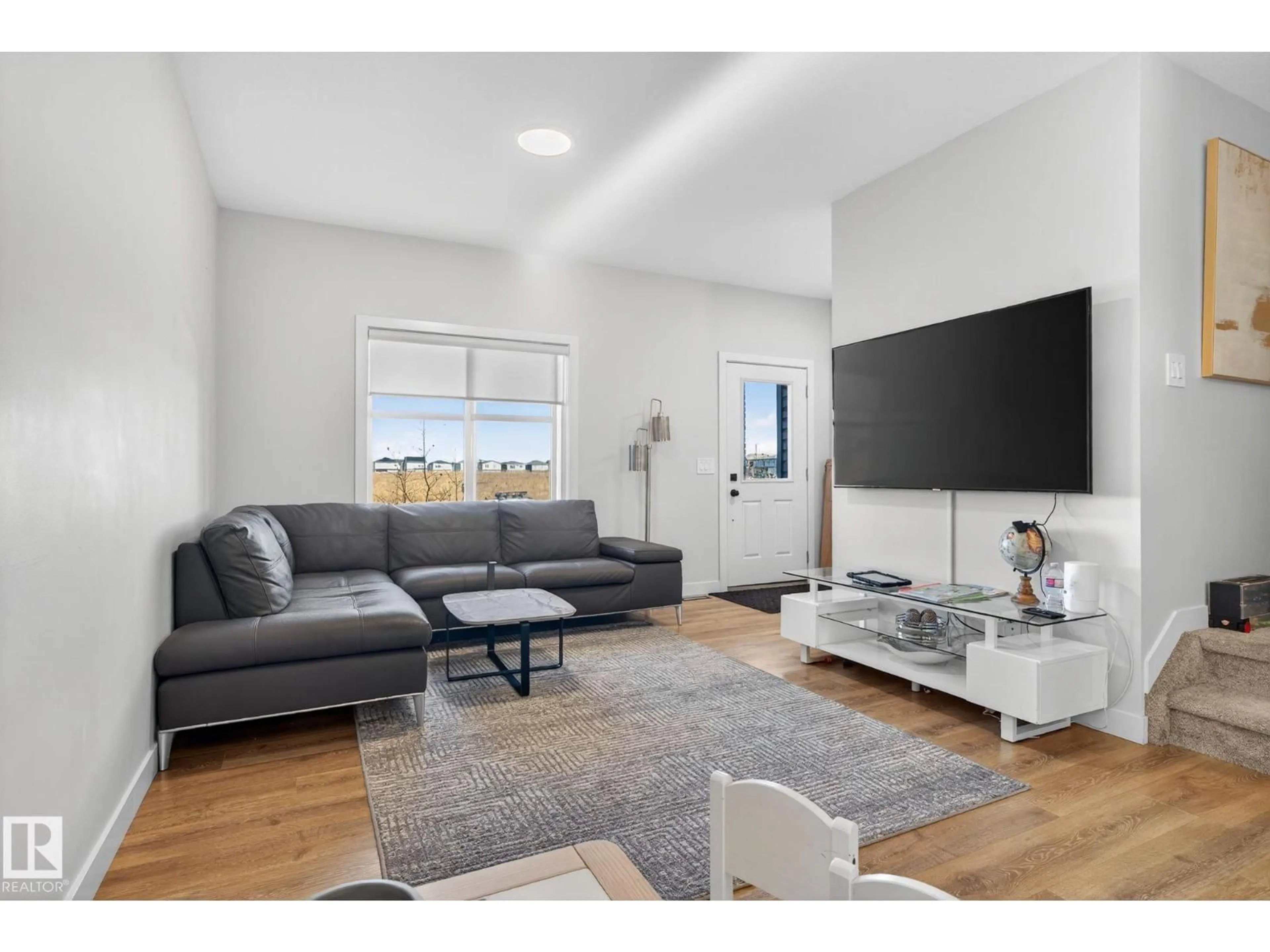 Living room with furniture, unknown for 7135 178 AV, Edmonton Alberta T5Z0T8