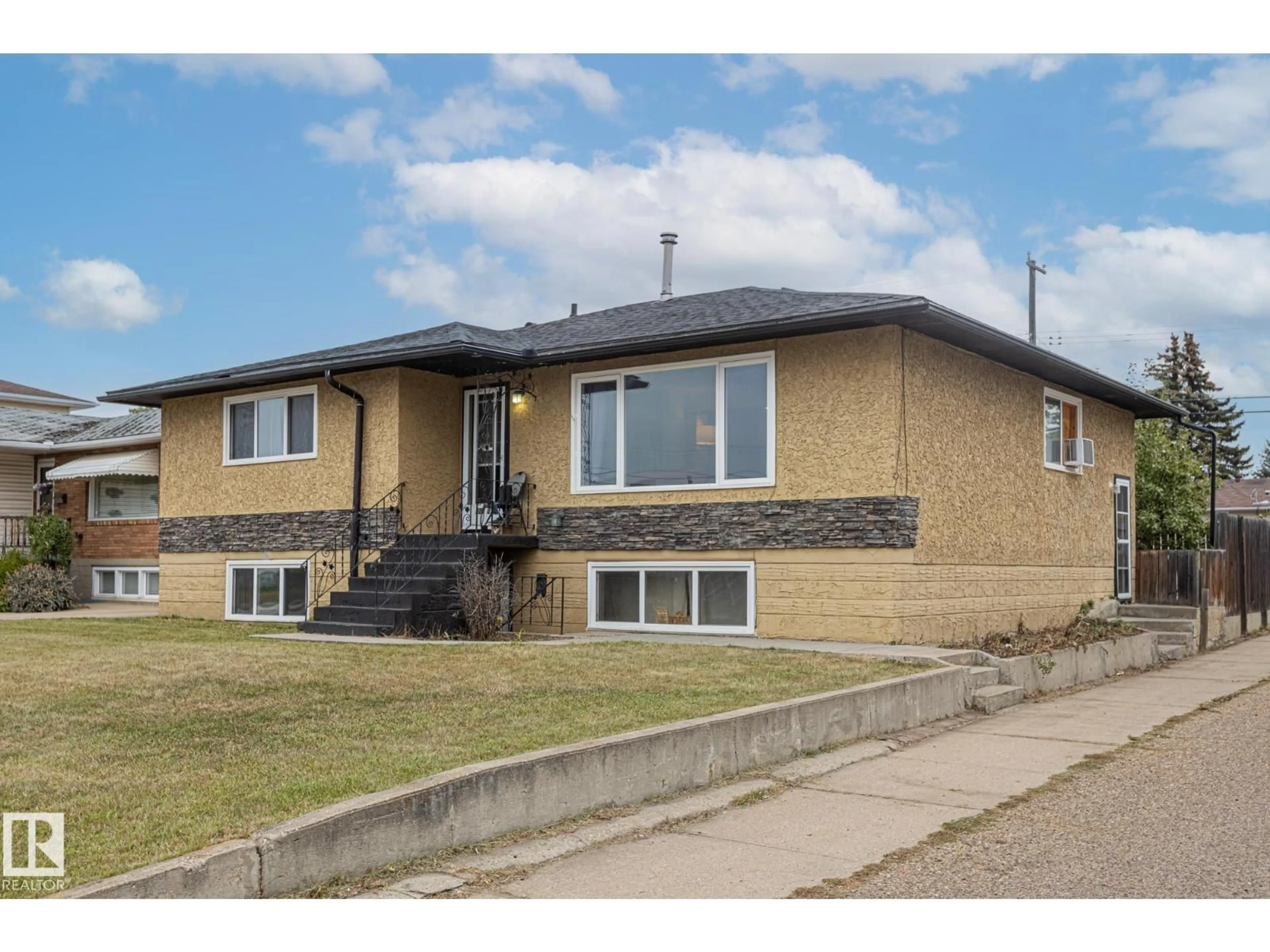 Home with brick exterior material, street for NW - 12903/12905 96 ST, Edmonton Alberta T5E4B2