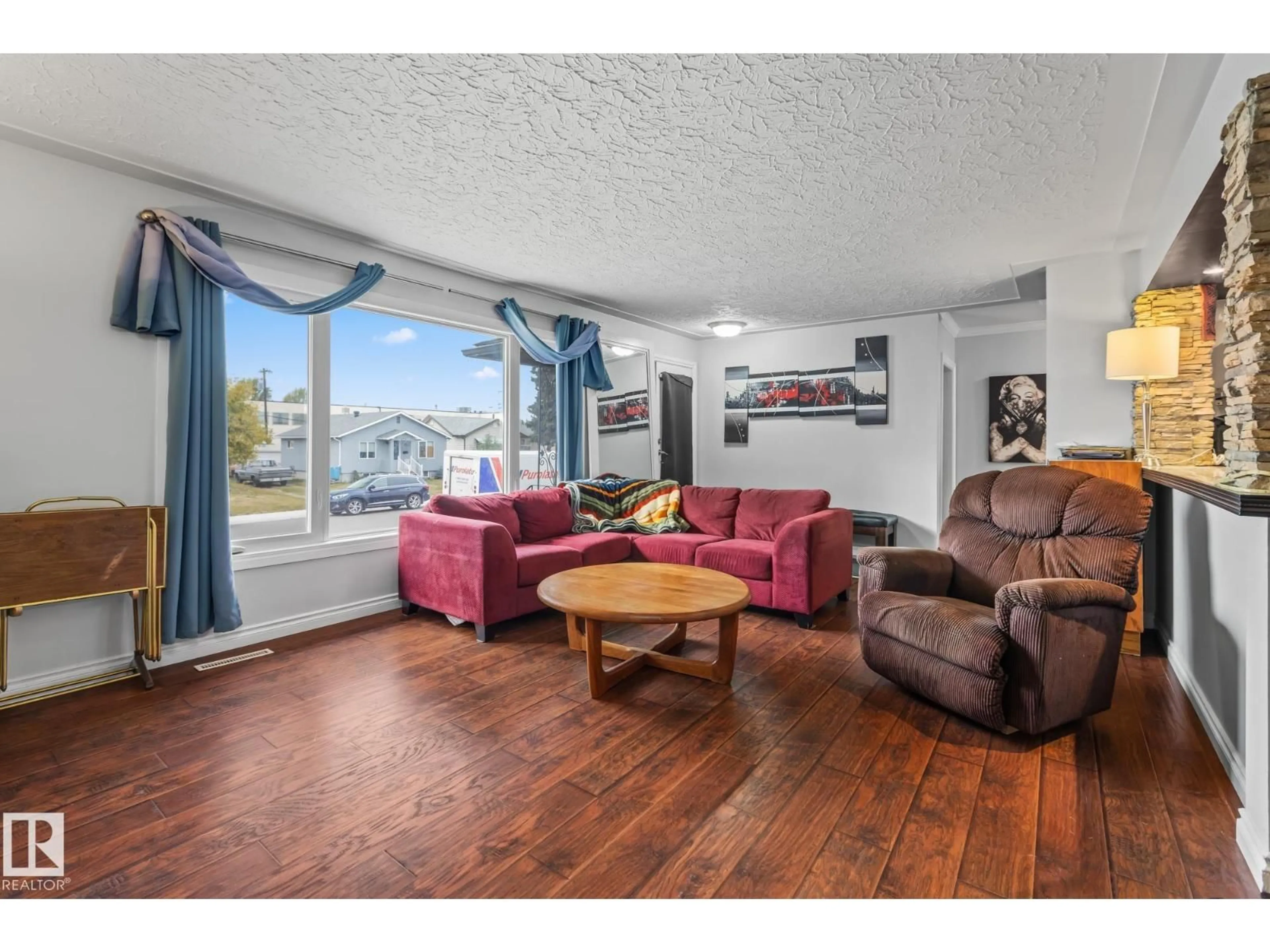 Living room with furniture, wood/laminate floor for NW - 12903/12905 96 ST, Edmonton Alberta T5E4B2