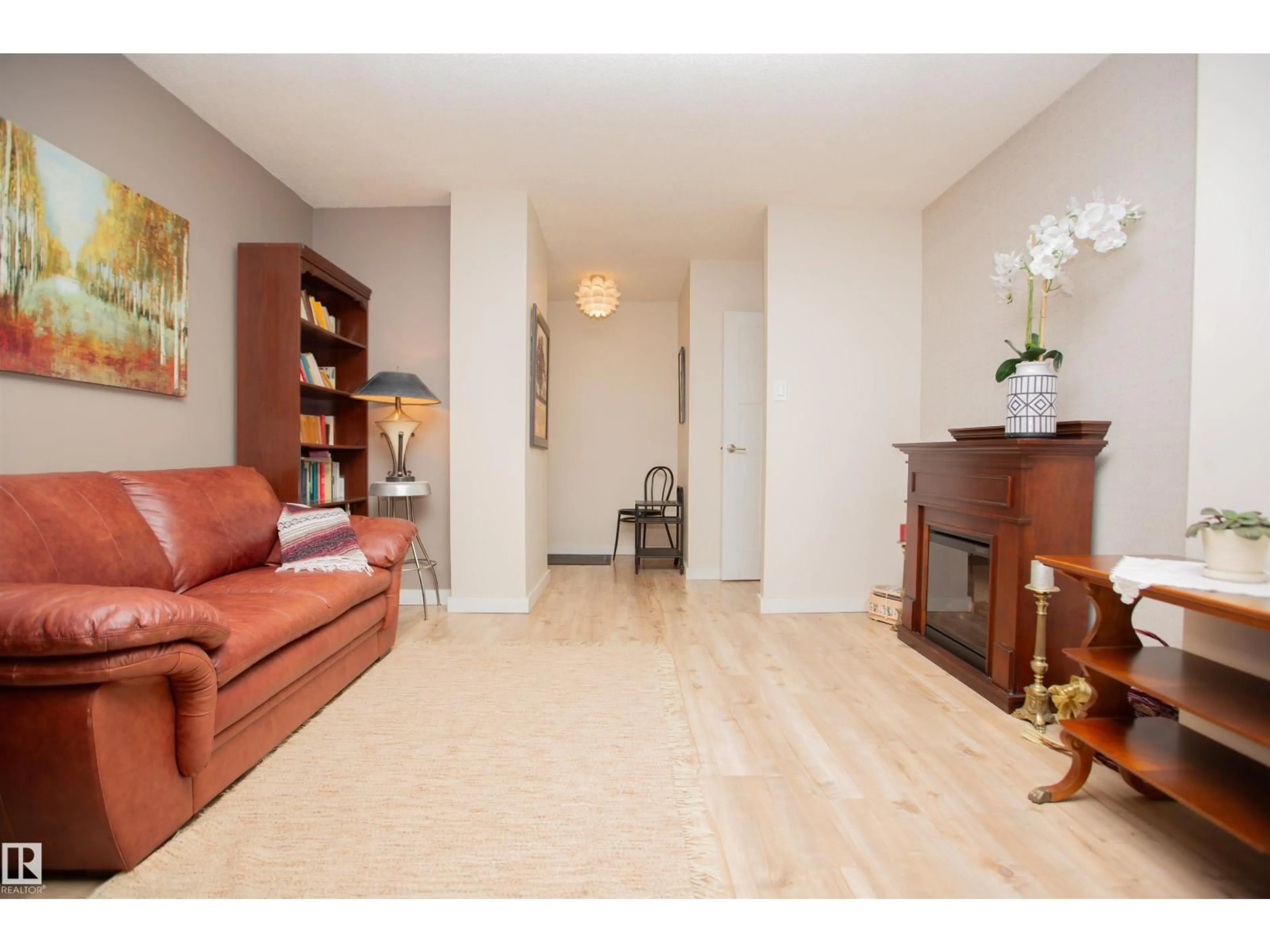 Living room with furniture, wood/laminate floor for 33 11112 129 ST NW, Edmonton Alberta T5M0Y5
