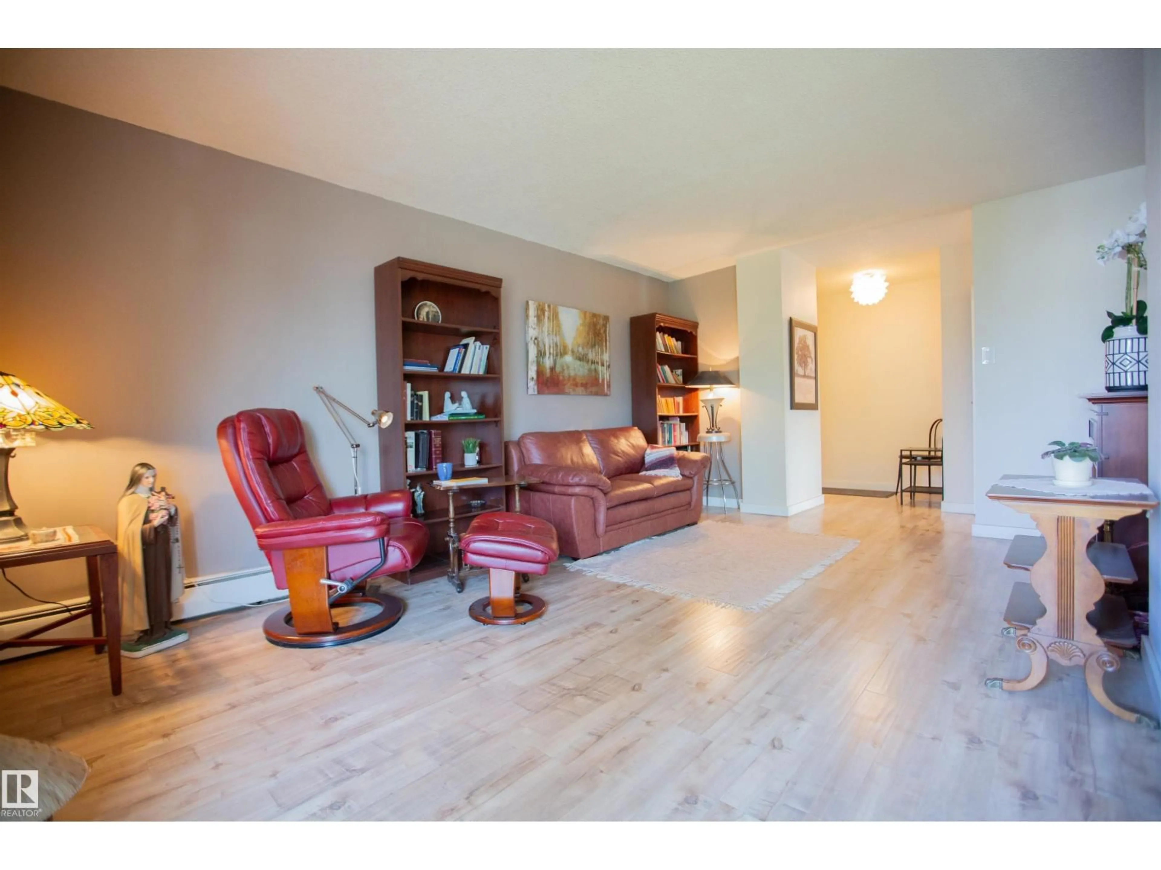 Living room with furniture, wood/laminate floor for 33 11112 129 ST NW, Edmonton Alberta T5M0Y5