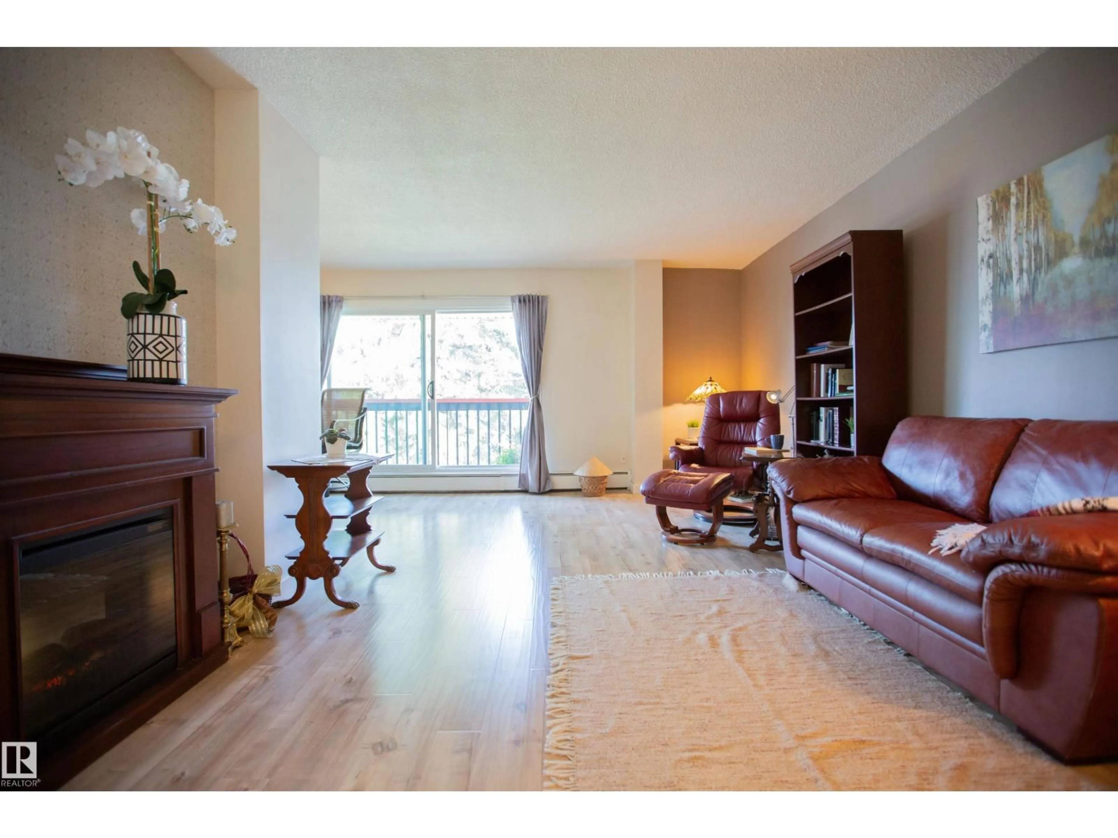 Living room with furniture, wood/laminate floor for 33 11112 129 ST NW, Edmonton Alberta T5M0Y5