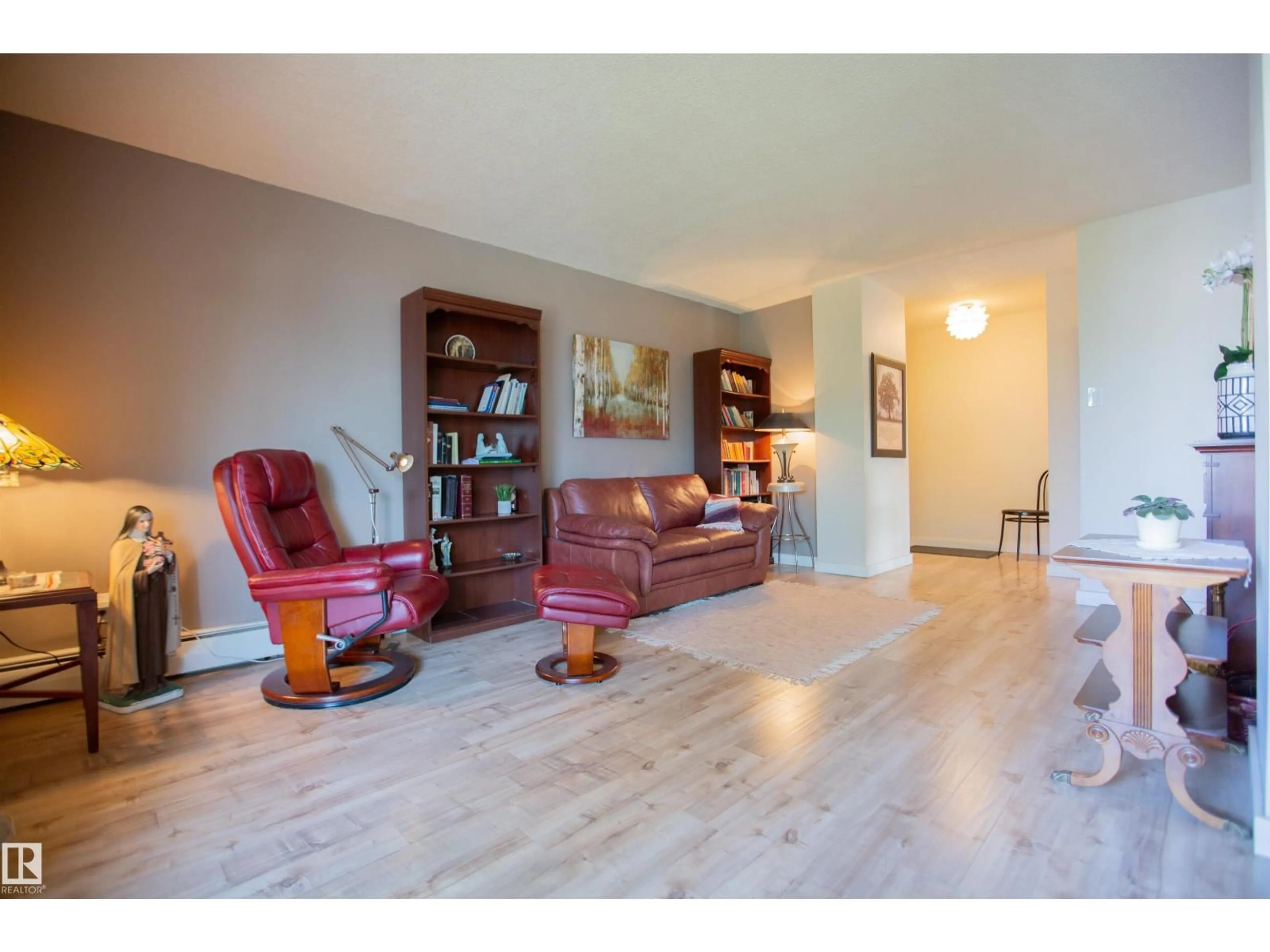 Living room with furniture, wood/laminate floor for 33 11112 129 ST NW, Edmonton Alberta T5M0Y5