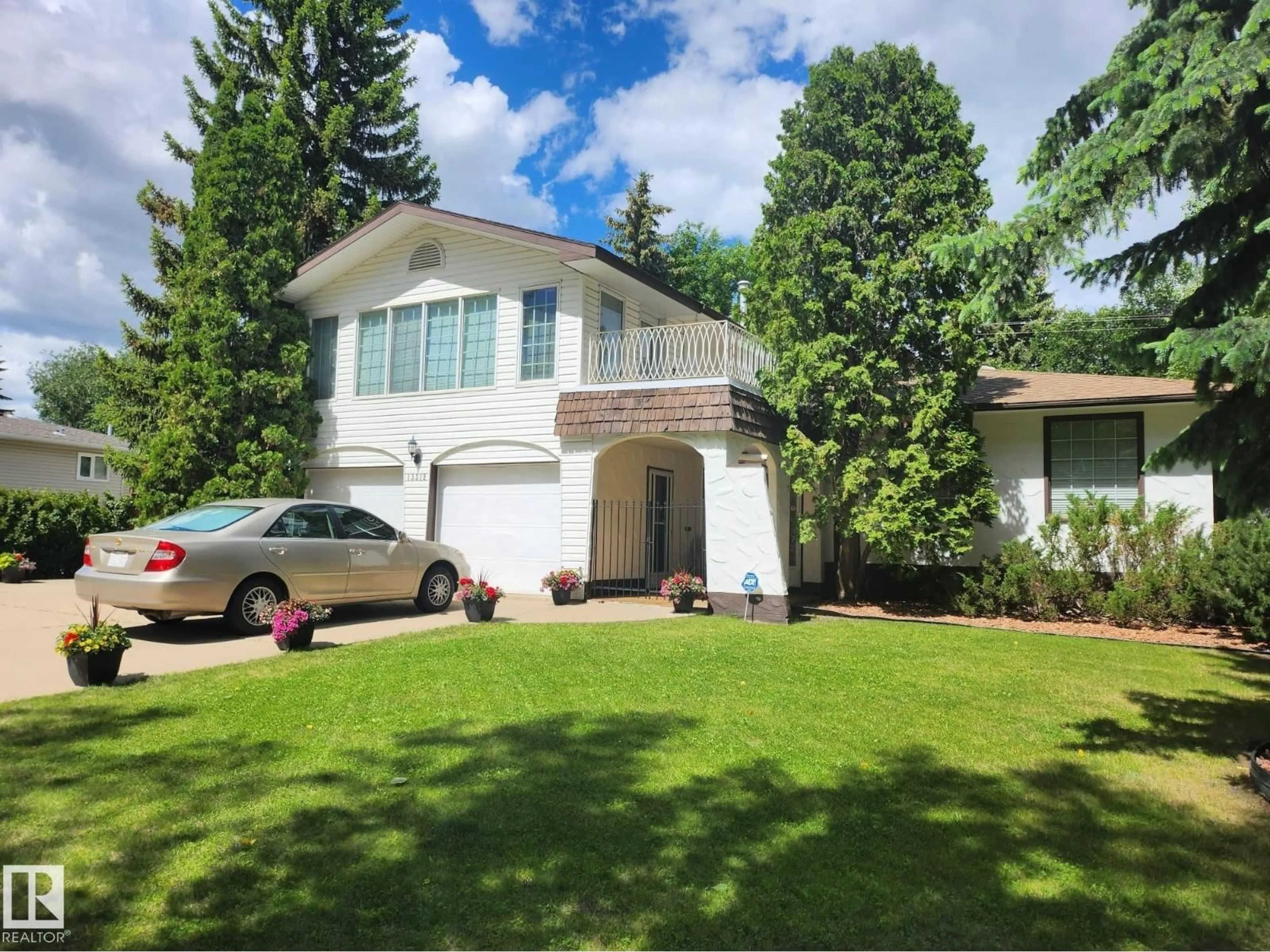 Home with vinyl exterior material, street for 13312 BUENA VISTA RD, Edmonton Alberta T5R5R2