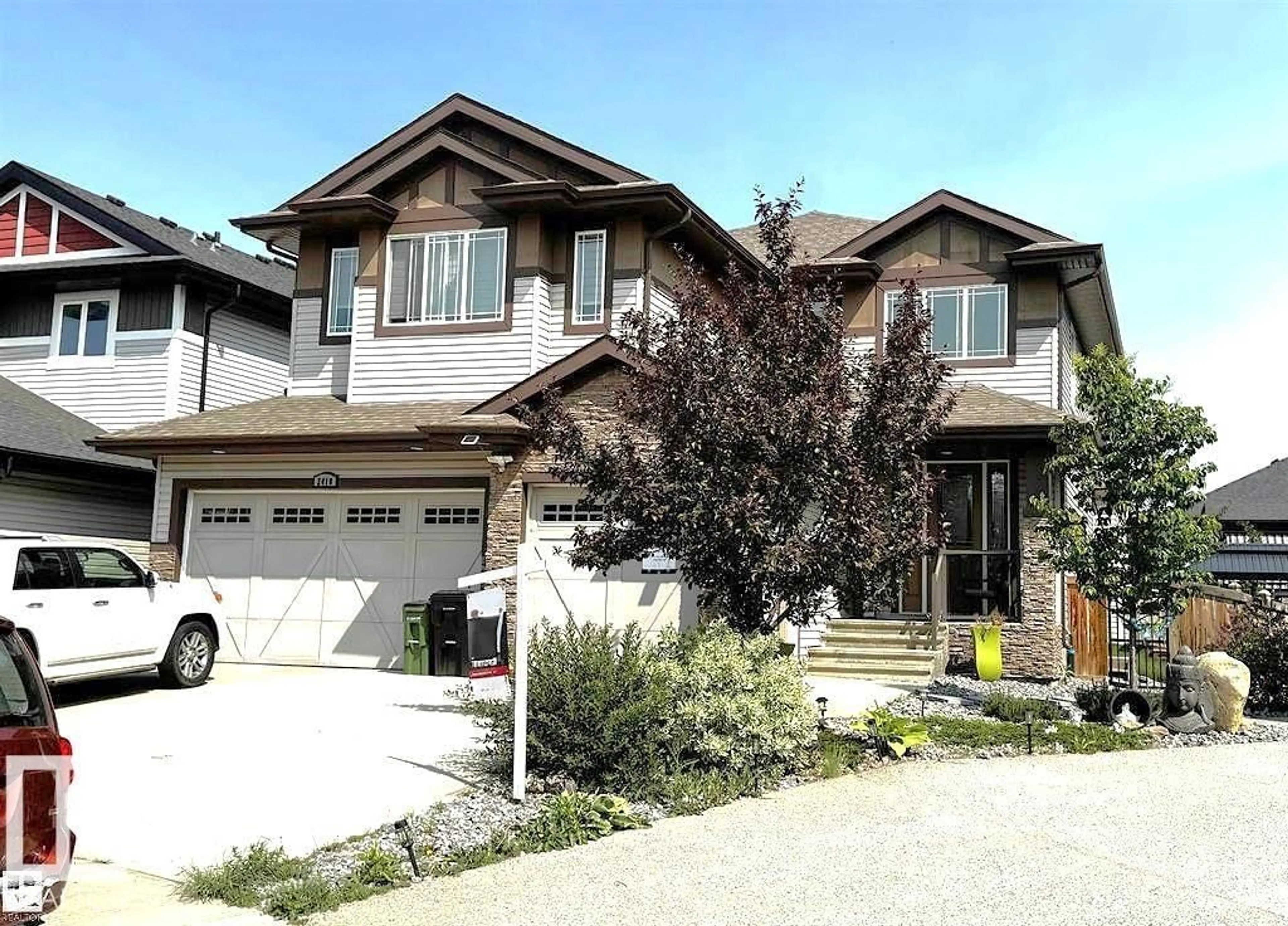 Home with vinyl exterior material, street for 2410 ASHCRAFT CR, Edmonton Alberta T6W2N1