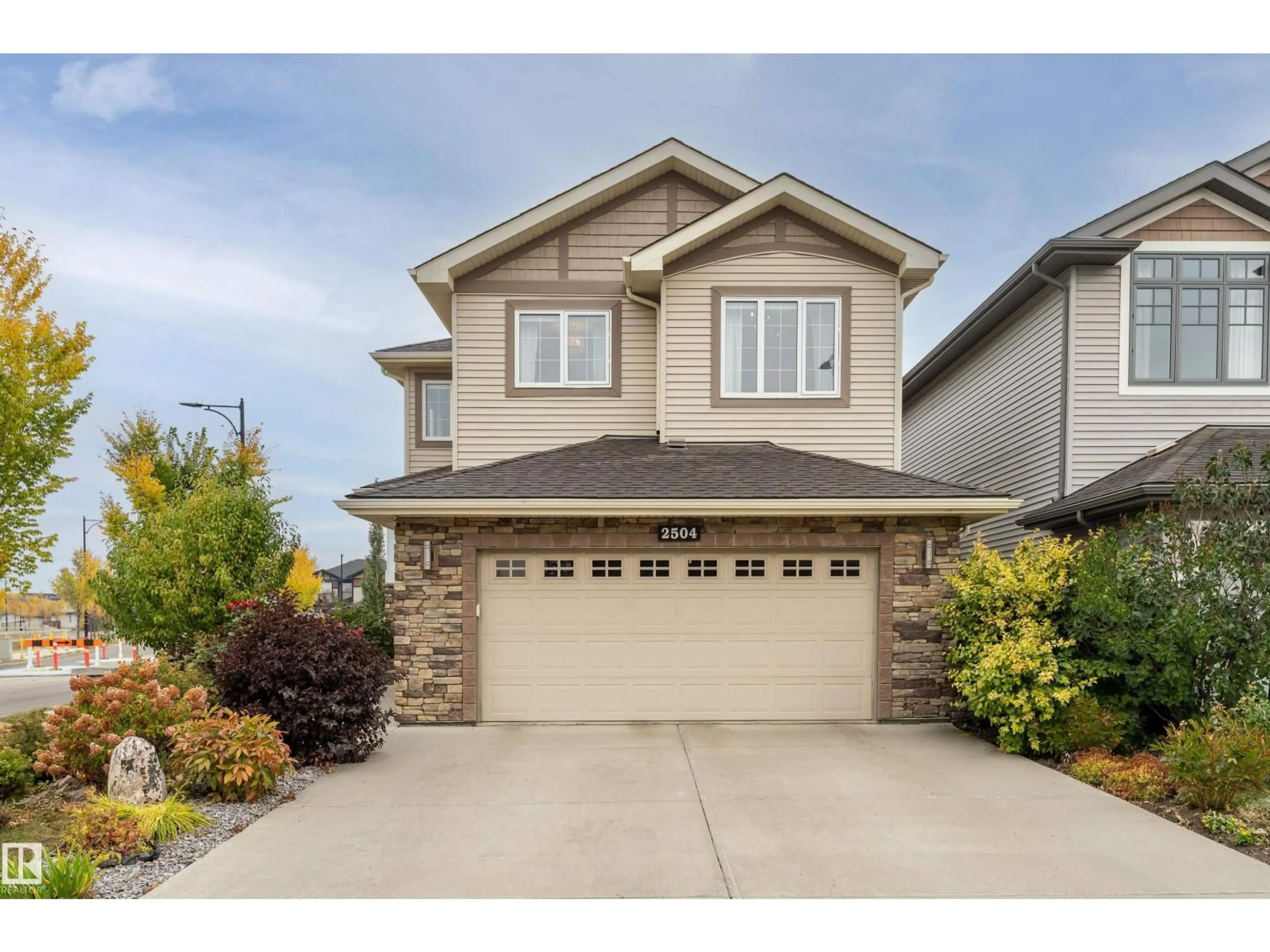 Home with vinyl exterior material, street for 2504 AMERONGEN CR, Edmonton Alberta T6W3C2