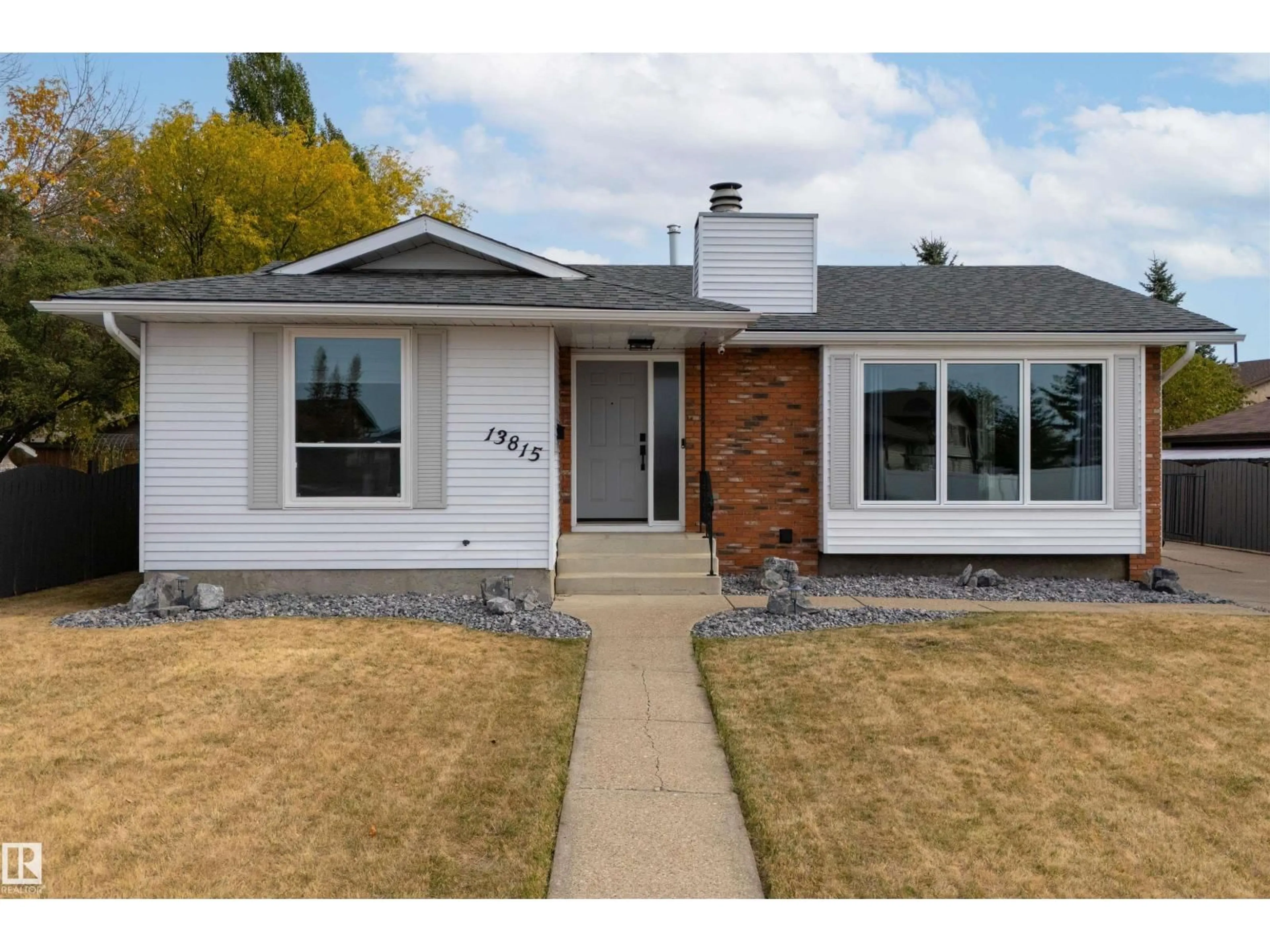 Home with brick exterior material, street for 13815 35 ST, Edmonton Alberta T5Y2E7