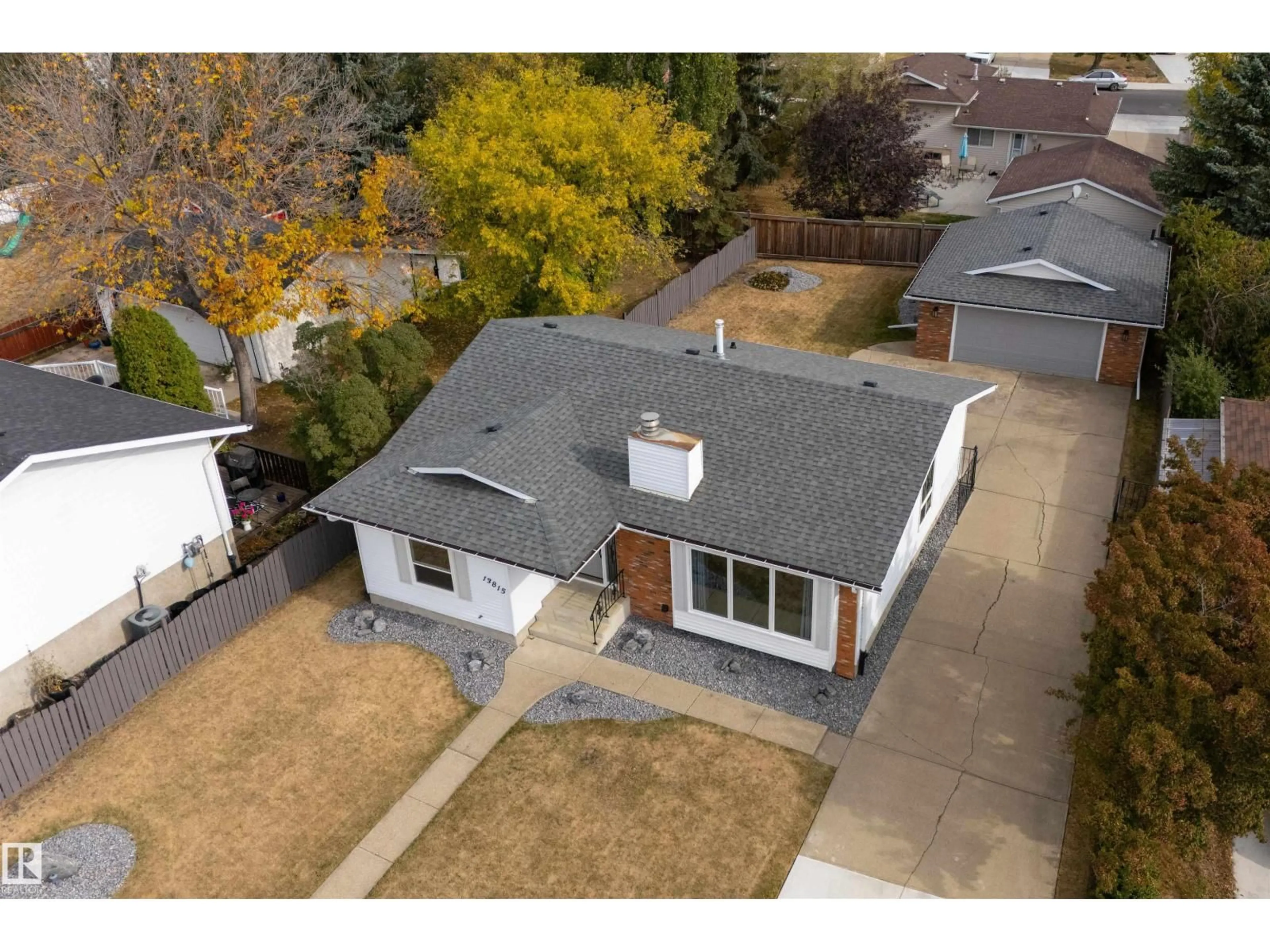 A pic from outside/outdoor area/front of a property/back of a property/a pic from drone, street for 13815 35 ST, Edmonton Alberta T5Y2E7
