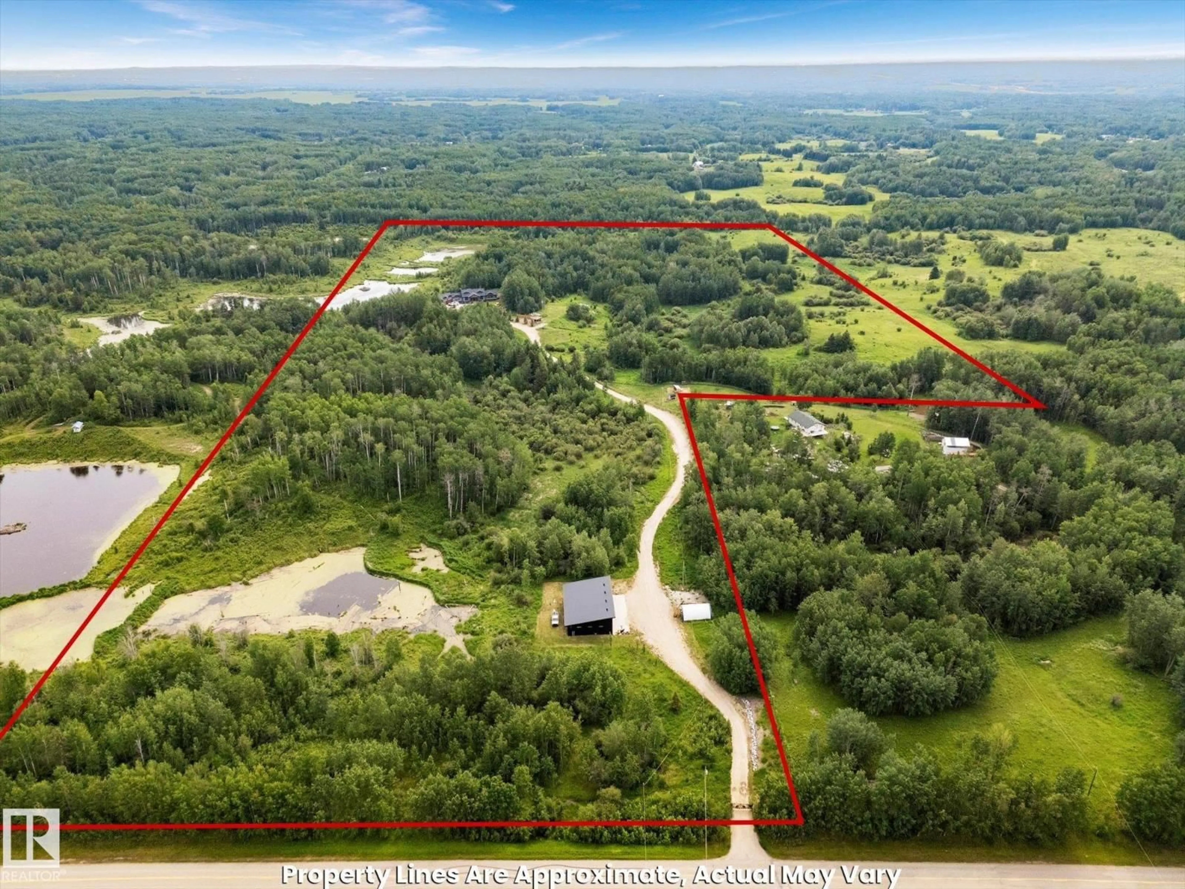 A pic from outside/outdoor area/front of a property/back of a property/a pic from drone, forest/trees view for 53313 RGE ROAD 30, Rural Parkland County Alberta T7Y0E2
