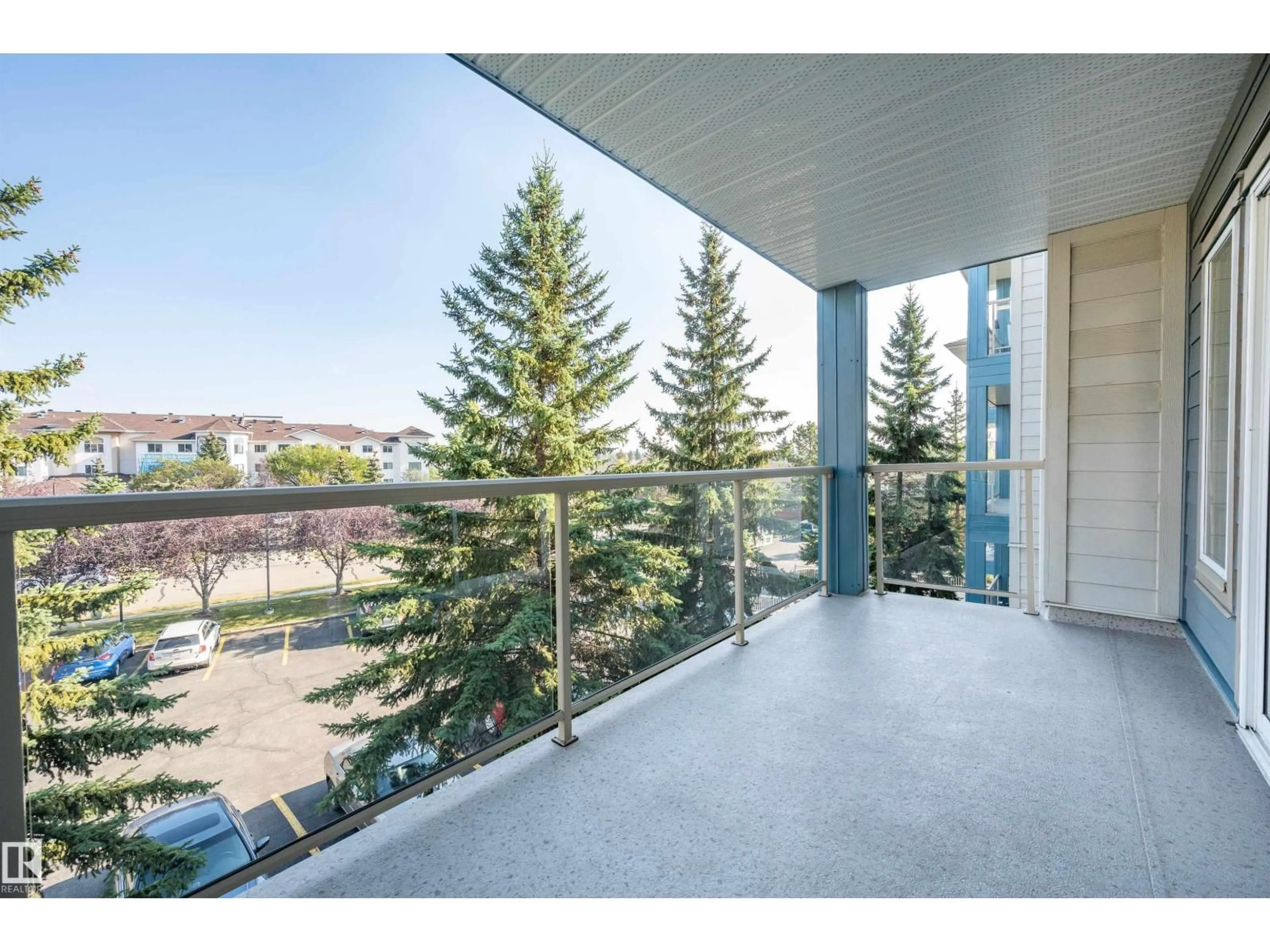 Balcony in the apartment, city buildings view from balcony for 302 - 302 CRYSTAL LN, Sherwood Park Alberta T8H1W6
