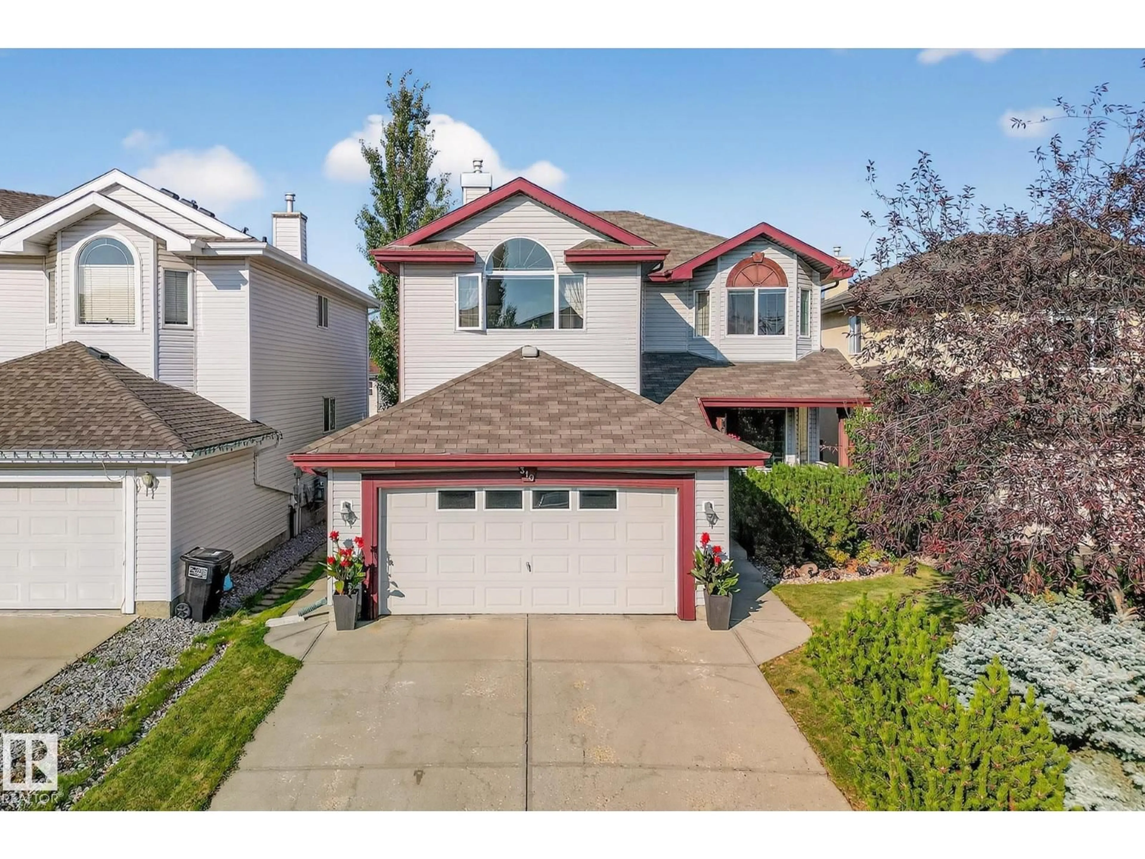 Home with vinyl exterior material, street for 310 HILLIARD CL, Edmonton Alberta T6R3G4