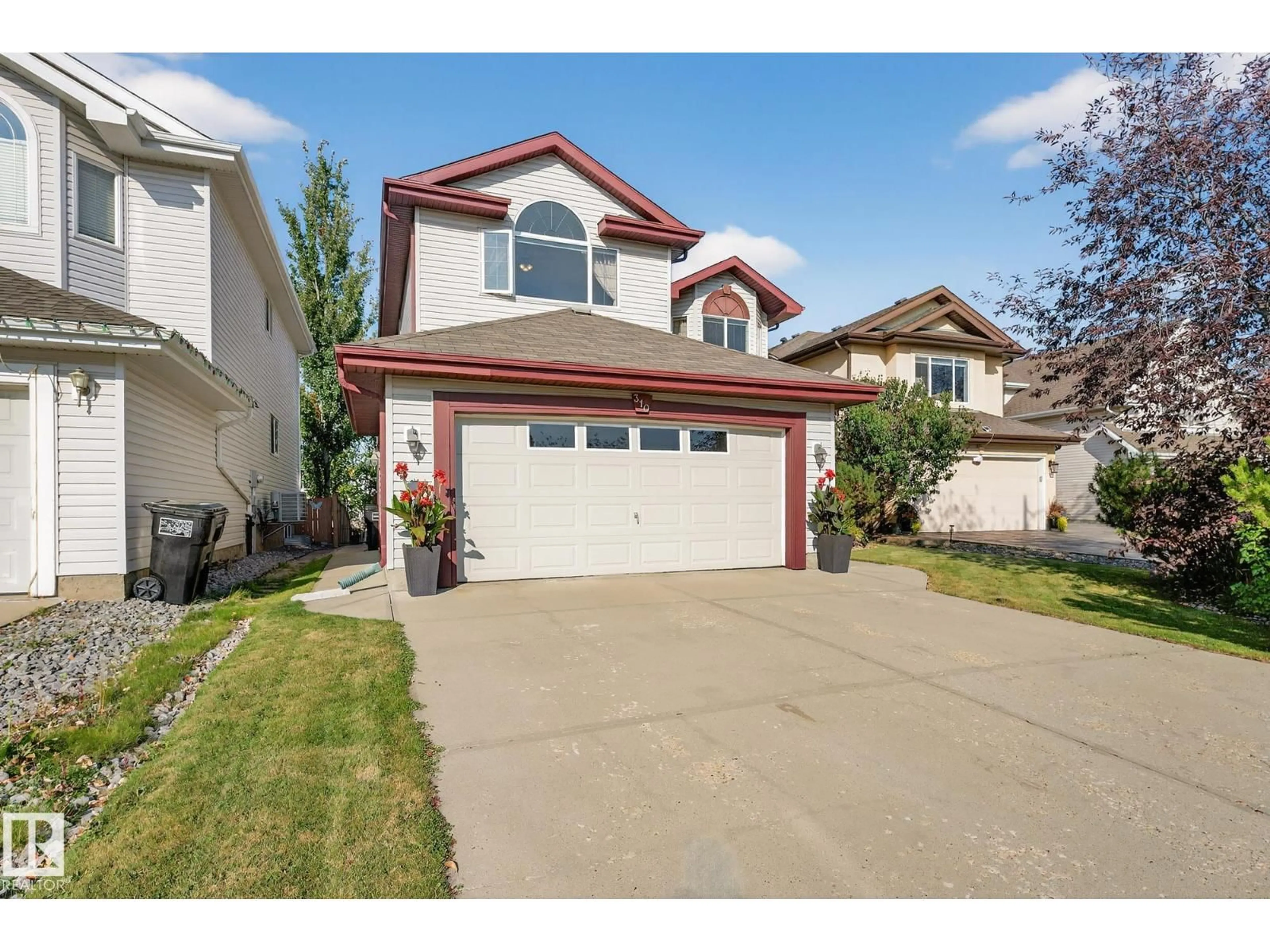 Home with vinyl exterior material, street for 310 HILLIARD CL, Edmonton Alberta T6R3G4