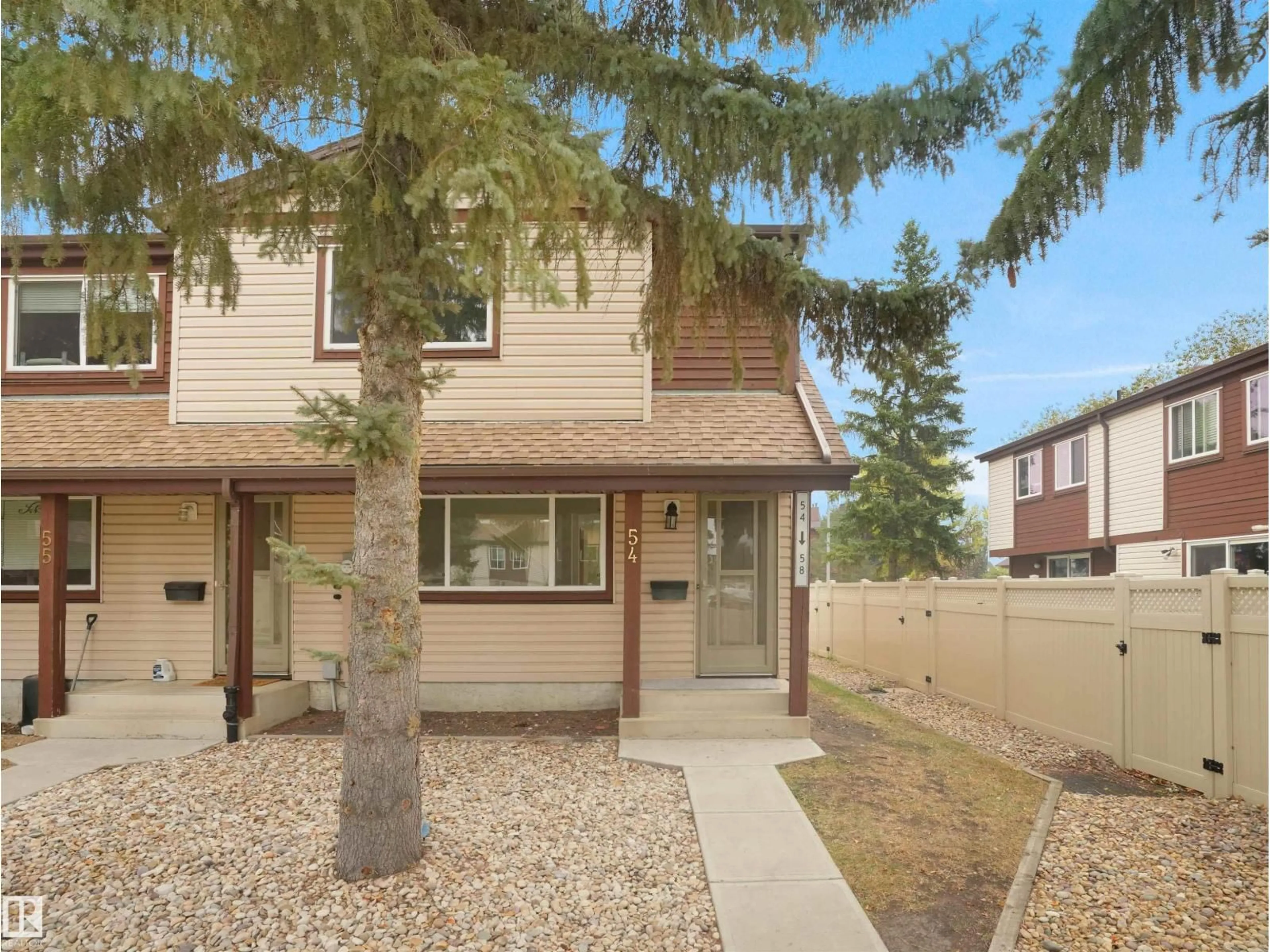 Home with vinyl exterior material, street for 54 13833 30 ST NW, Edmonton Alberta T5Y2B2