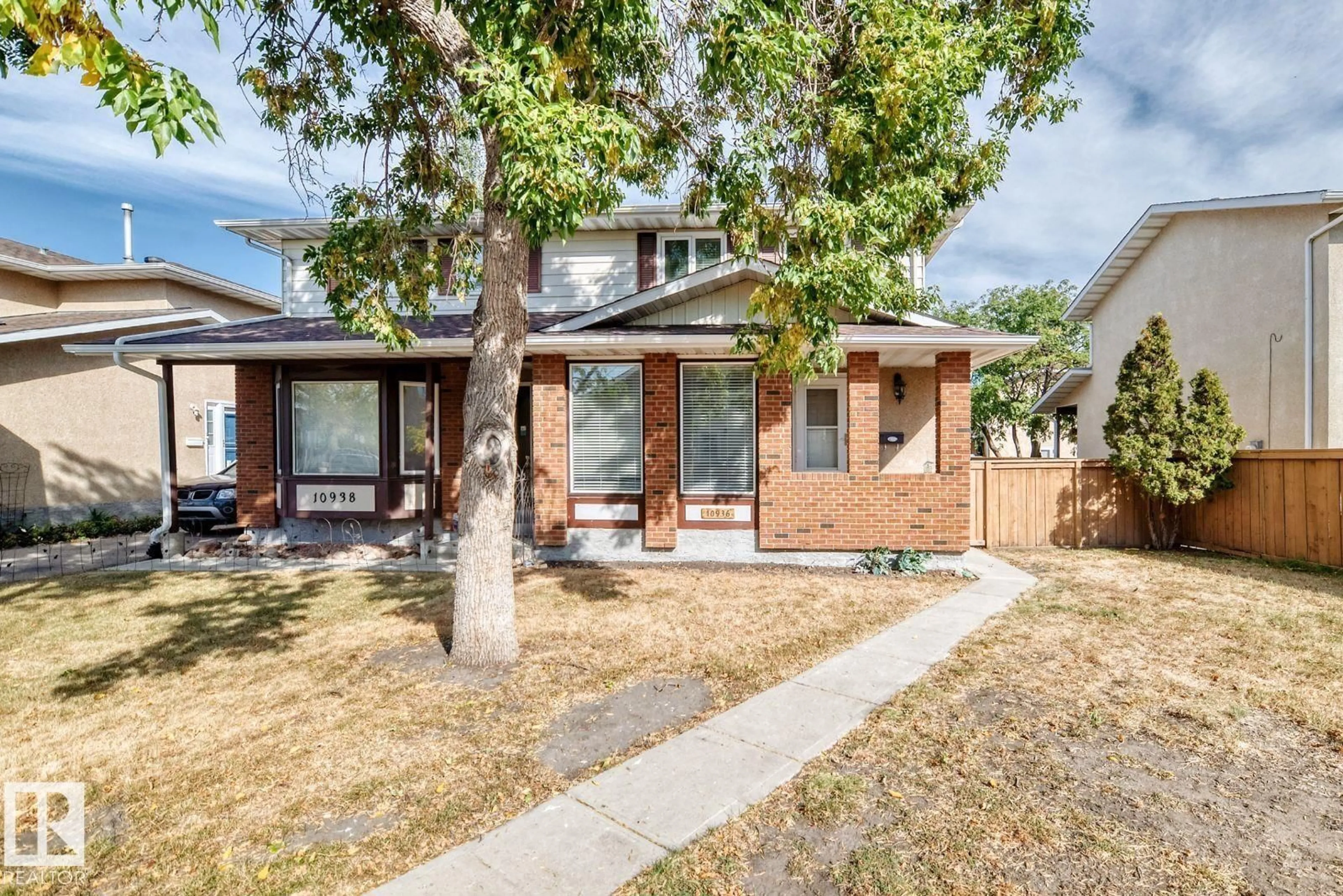 Home with brick exterior material, street for 10936 BEAUMARIS RD, Edmonton Alberta T5X1Z6