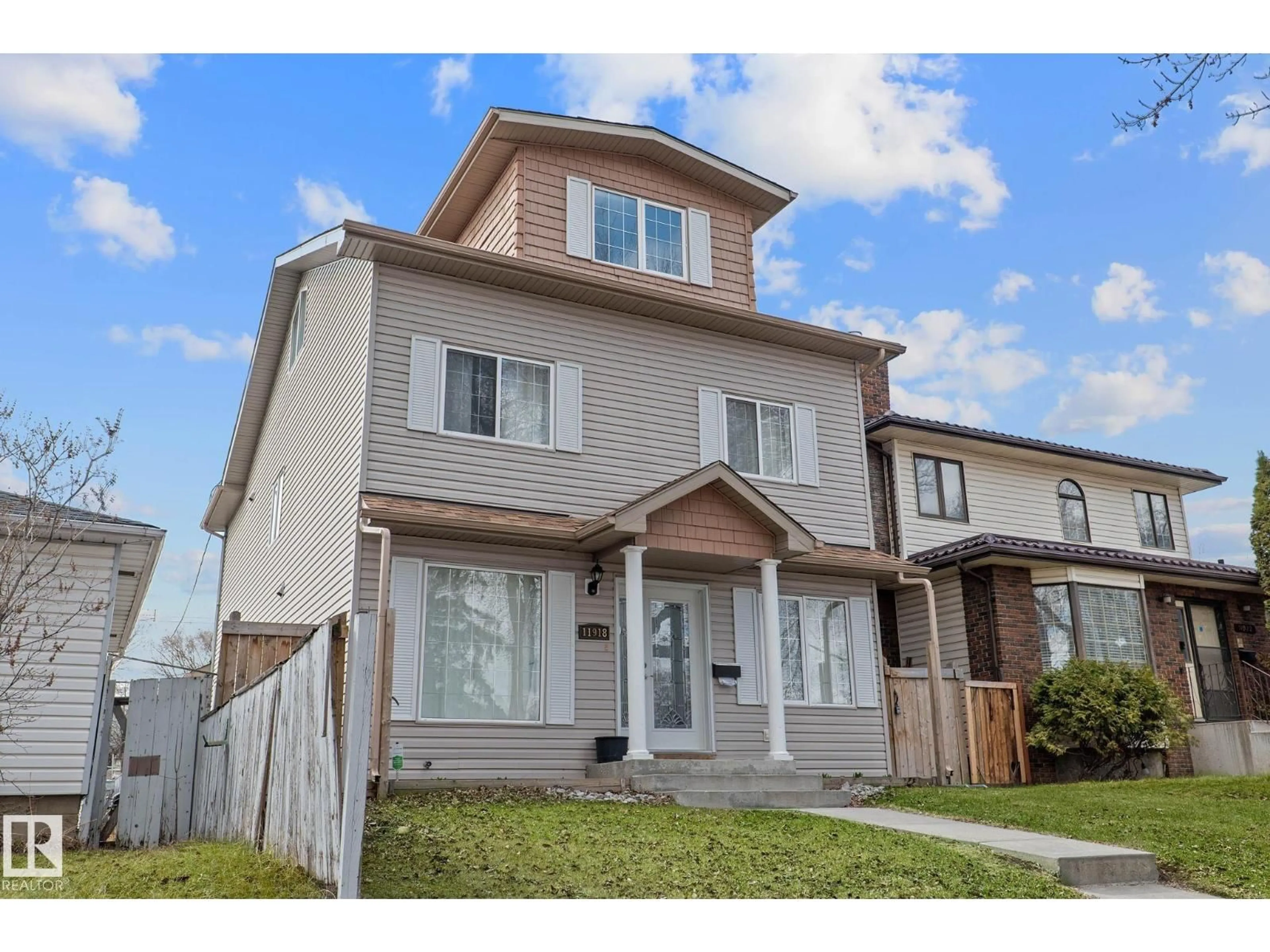 Home with vinyl exterior material, street for NW - 11918 68 ST, Edmonton Alberta T5B1P7