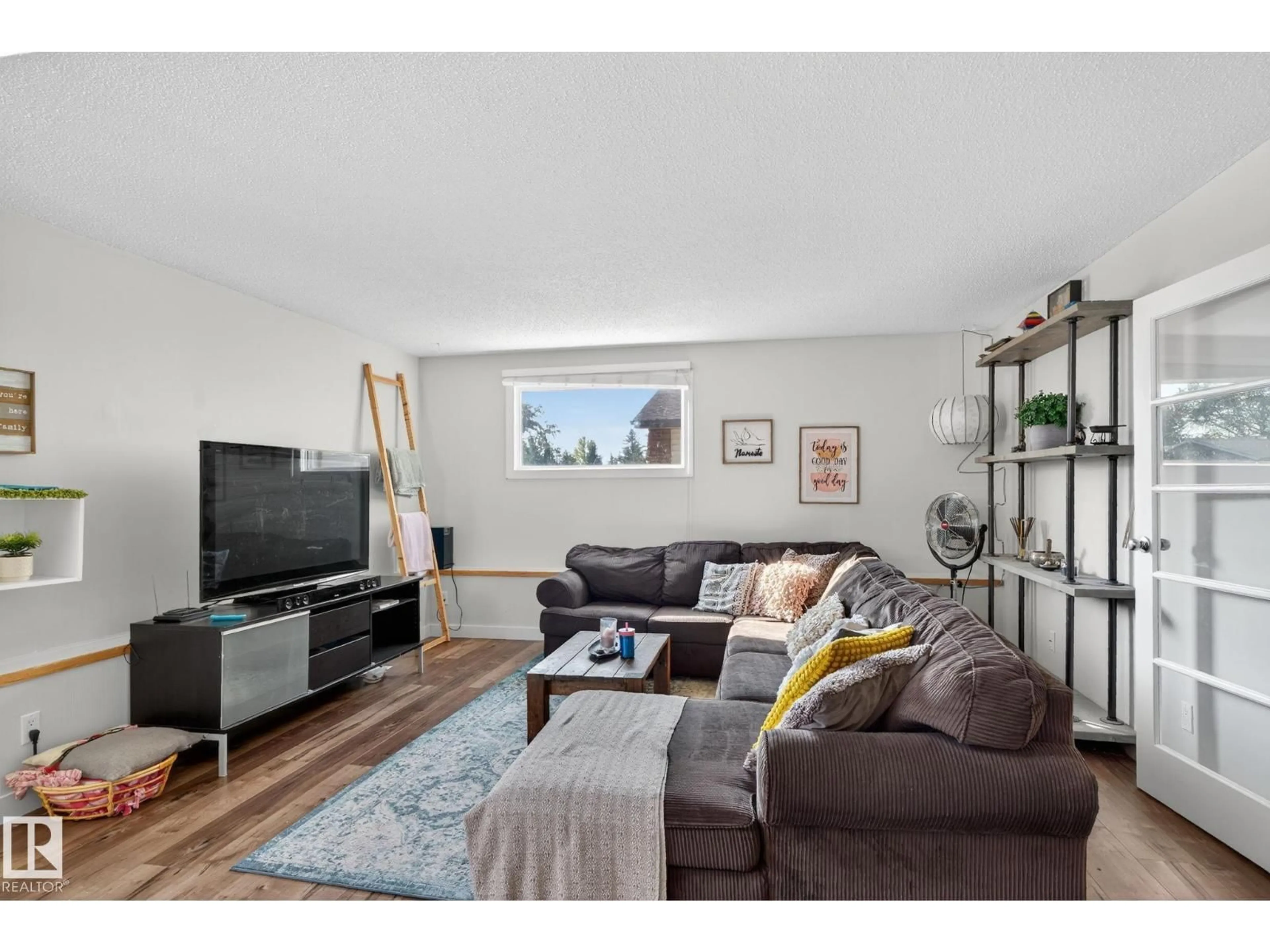 Living room with furniture, wood/laminate floor for 3608 51 ST NW, Edmonton Alberta T6L1C6