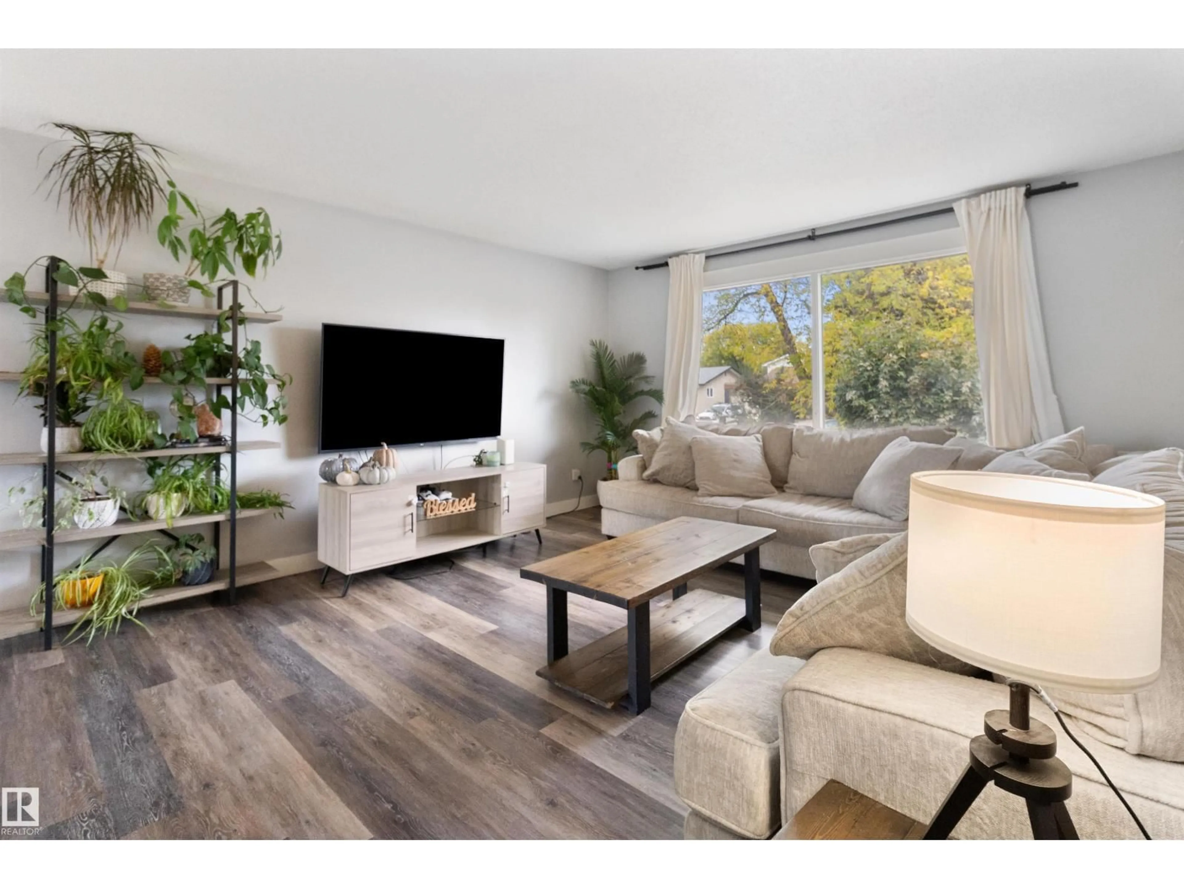 Living room with furniture, wood/laminate floor for 64 GREENWOOD WY, Sherwood Park Alberta T8A0J5