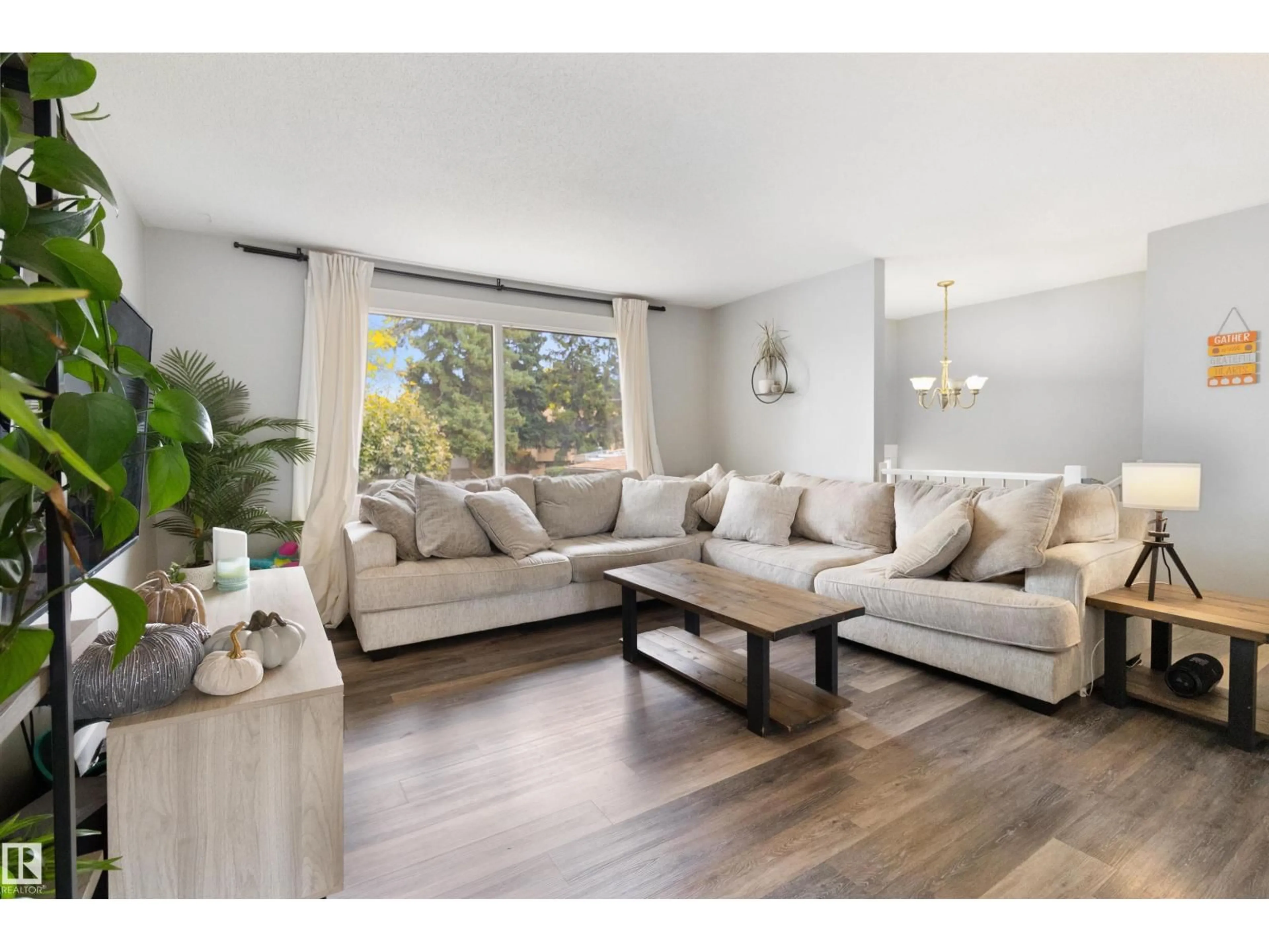 Living room with furniture, wood/laminate floor for 64 GREENWOOD WY, Sherwood Park Alberta T8A0J5
