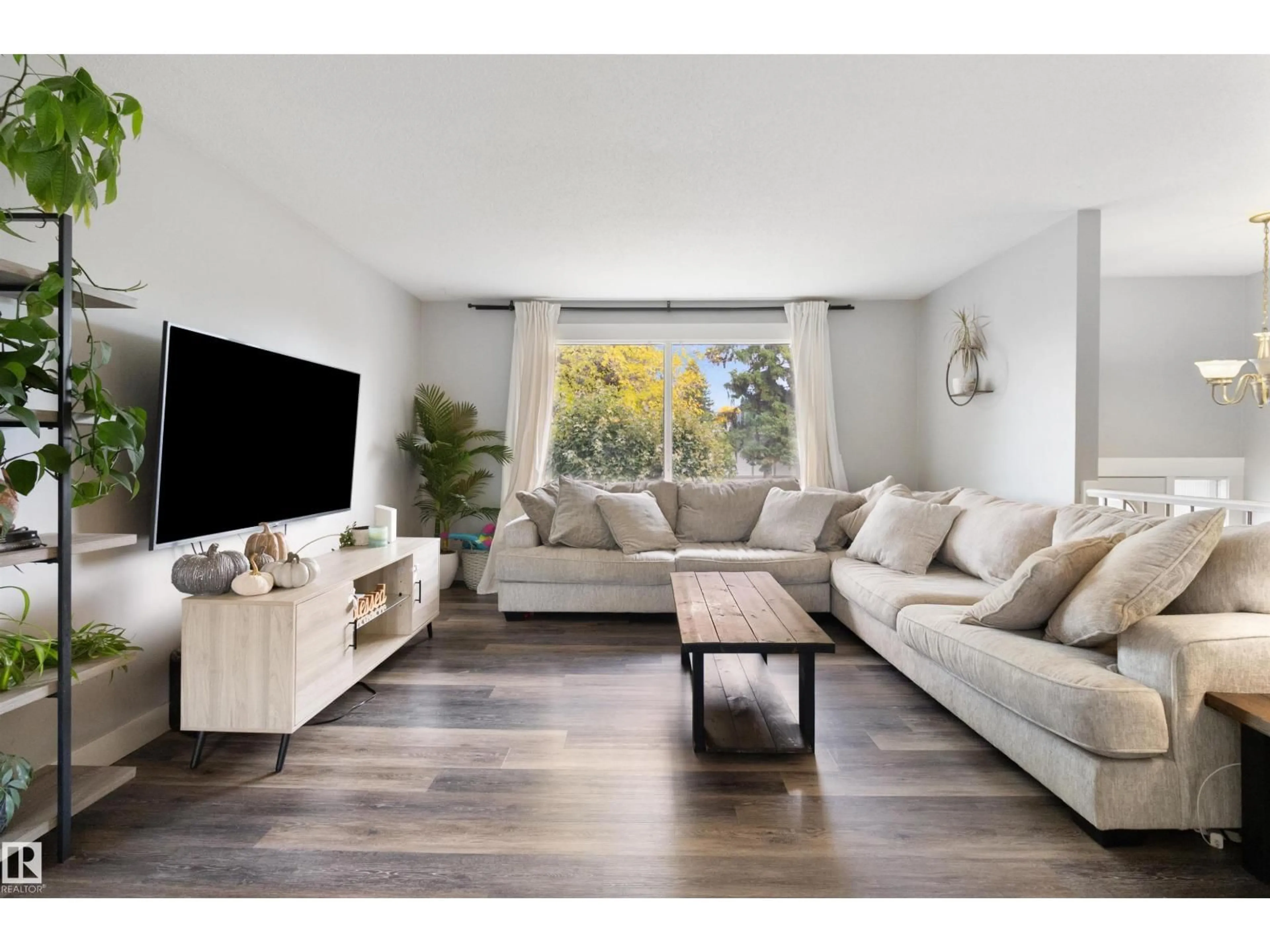 Living room with furniture, wood/laminate floor for 64 GREENWOOD WY, Sherwood Park Alberta T8A0J5