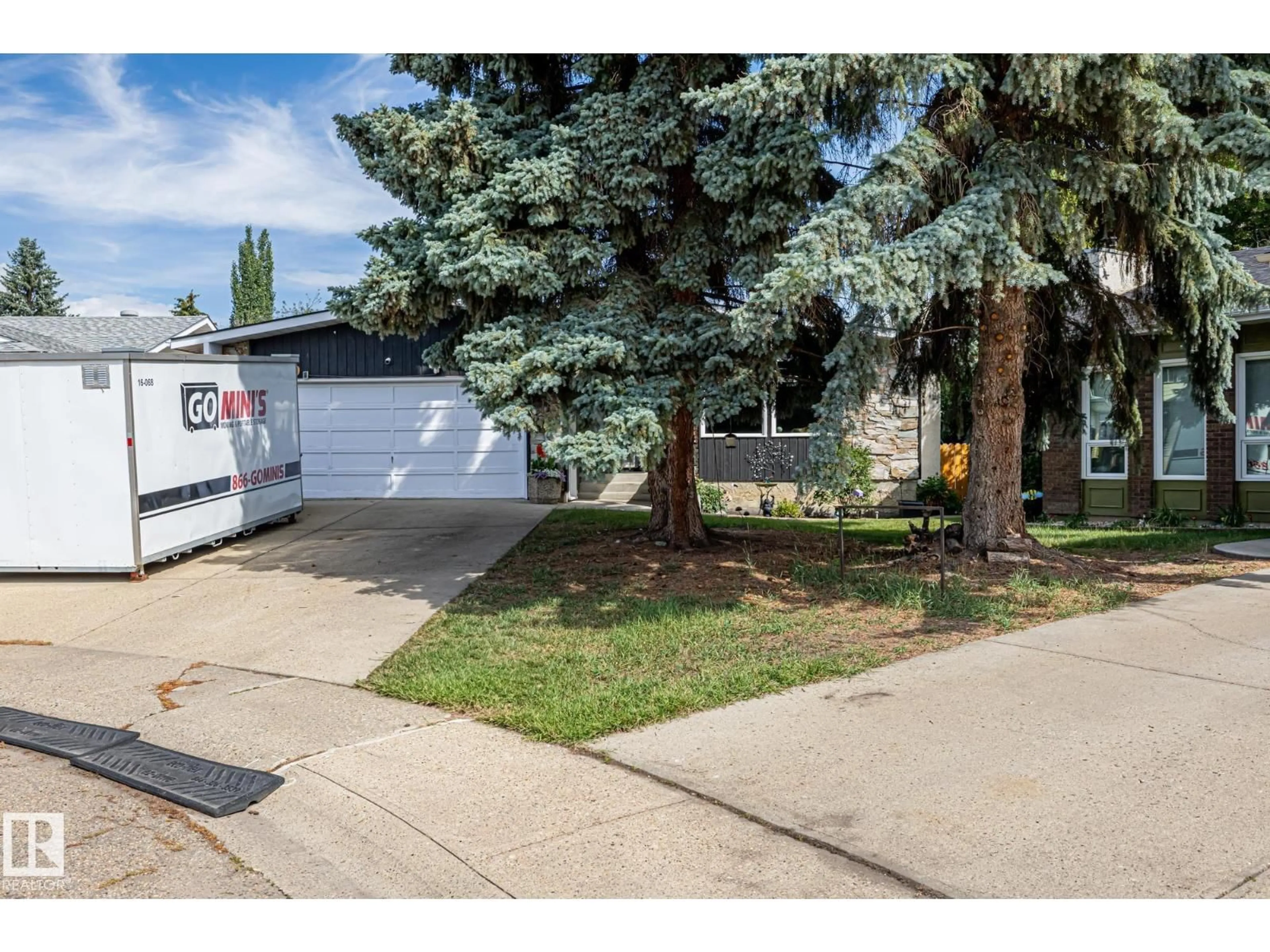 Home with vinyl exterior material, street for 12250 143 AV, Edmonton Alberta T5X3R7