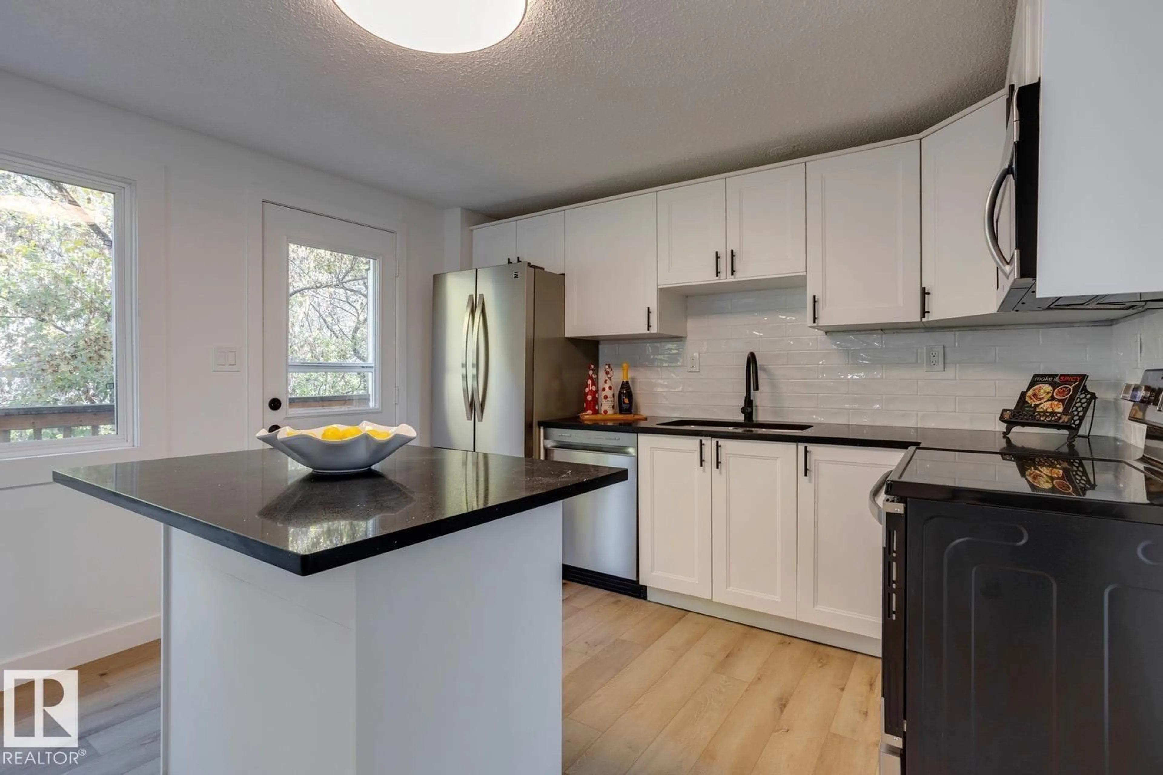 Open concept kitchen, wood/laminate floor for 73 RIDGEWOOD TC, St. Albert Alberta T8N0E9