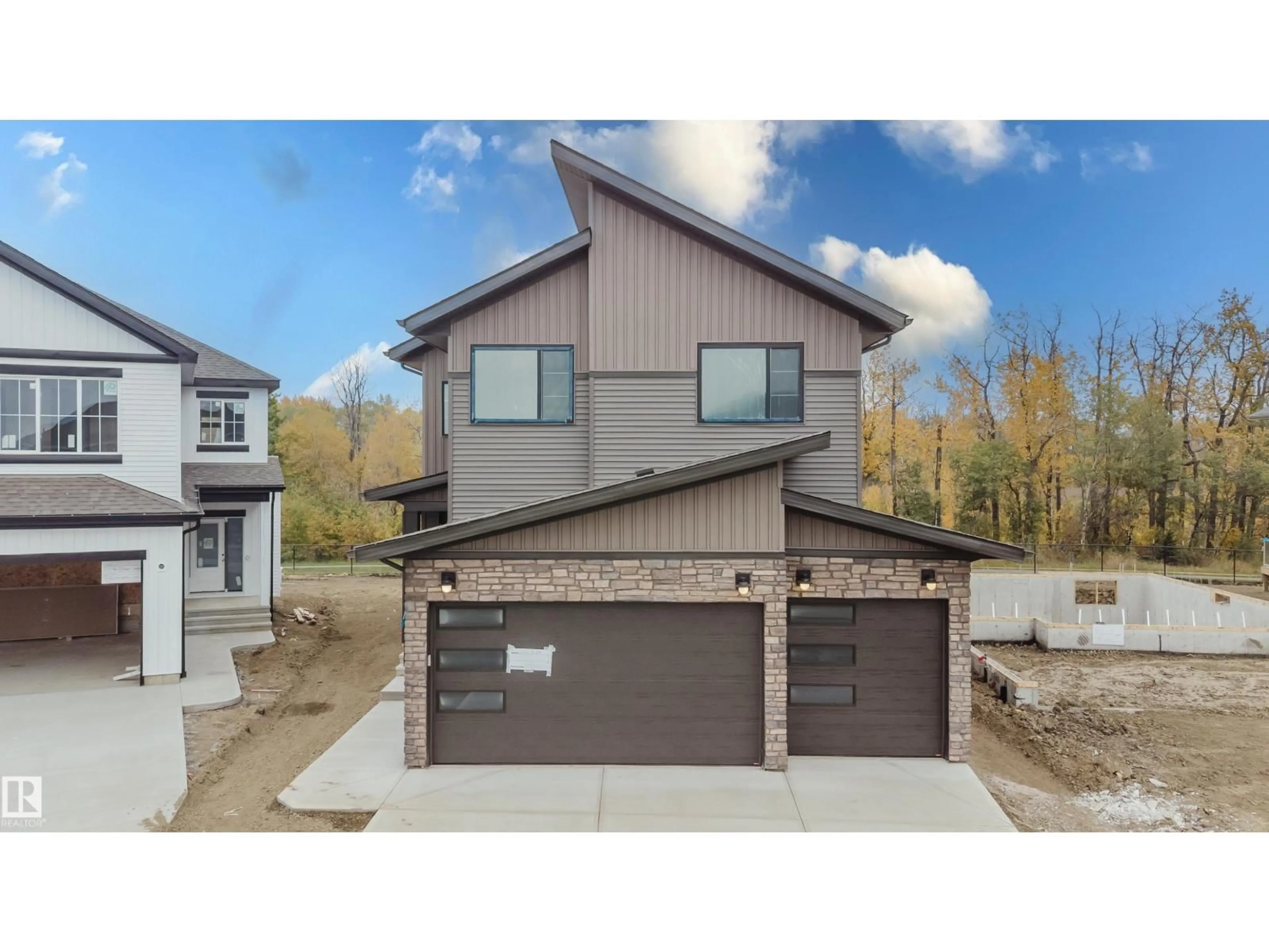 Home with brick exterior material, street for 21112 26 AV, Edmonton Alberta T6M3H2