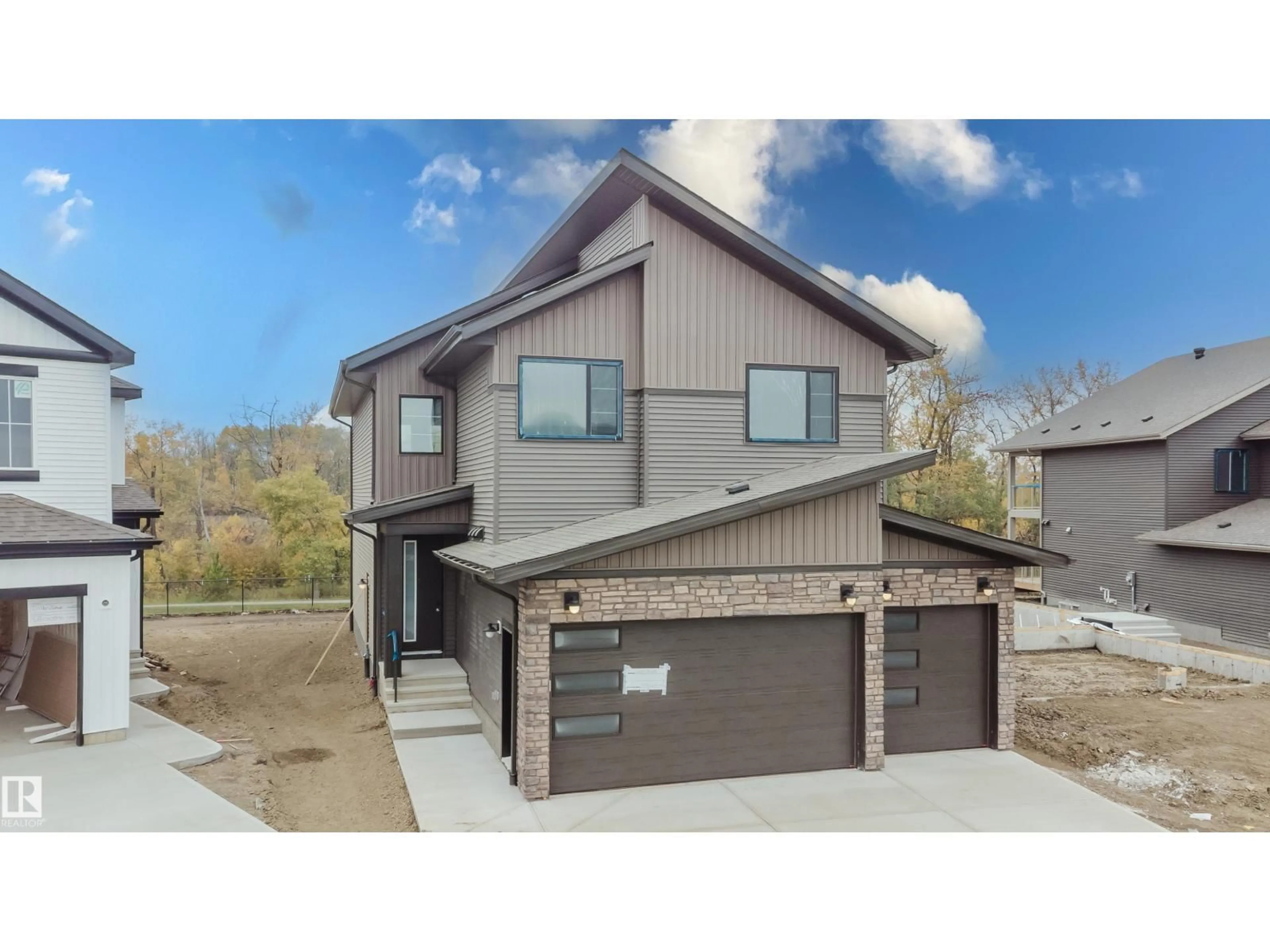 Home with brick exterior material, street for 21112 26 AV, Edmonton Alberta T6M3H2