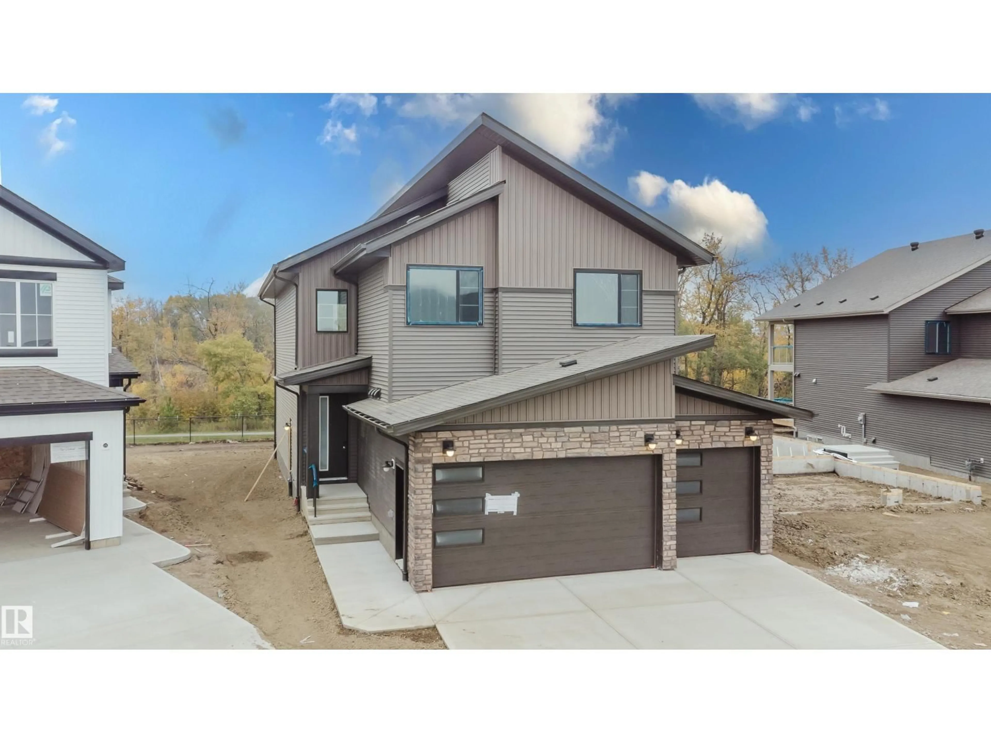 Home with brick exterior material, street for 21112 26 AV, Edmonton Alberta T6M3H2