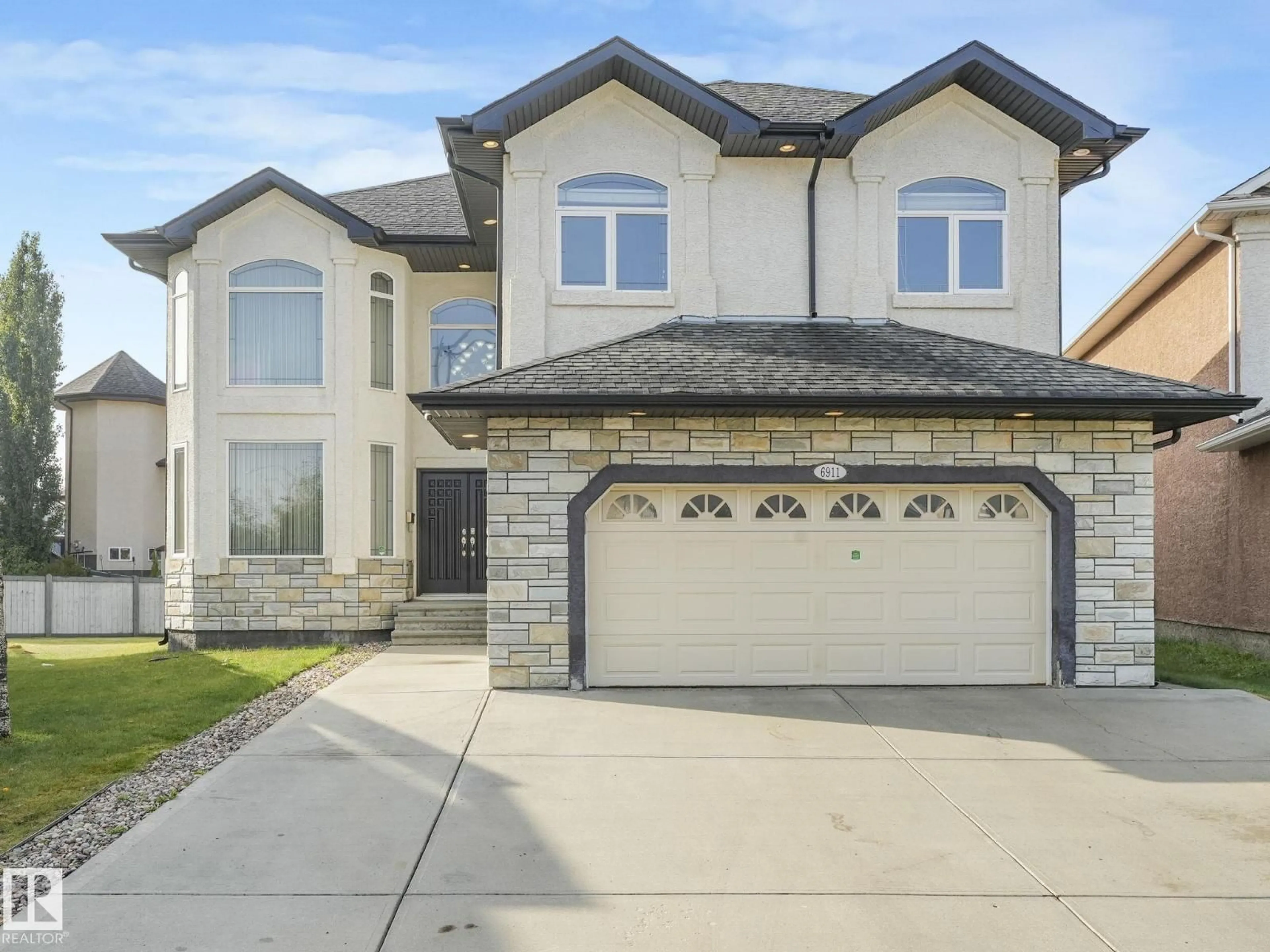 Home with brick exterior material, street for SW - 6911 17 AV, Edmonton Alberta T6X0C9