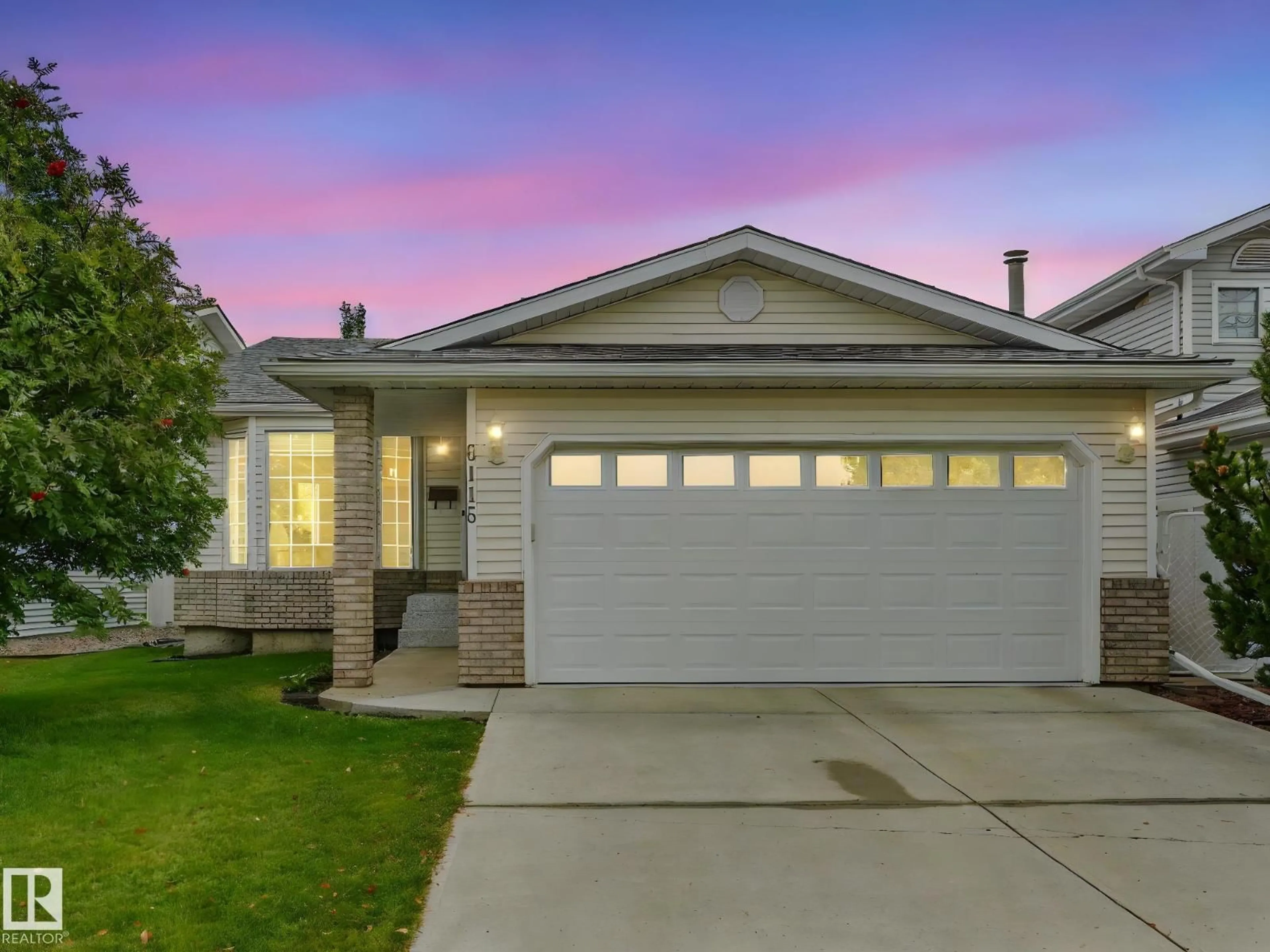 Home with vinyl exterior material, street for 6115 157 AV NW, Edmonton Alberta T5Y2P5